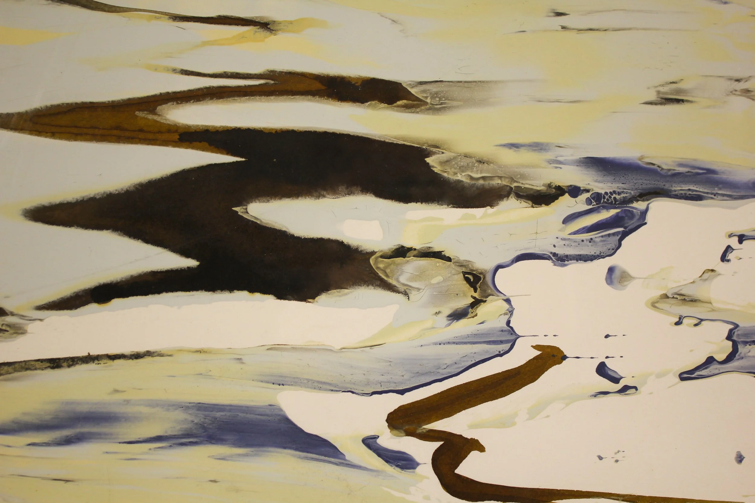 An abstracted ink painting that suggests waves depositing into to the beach. Paint and ink has been poured, seeped and dripped onto the surface in a calligraphic style with earth tones, frothy lemon whites and deeper slate grey tones.