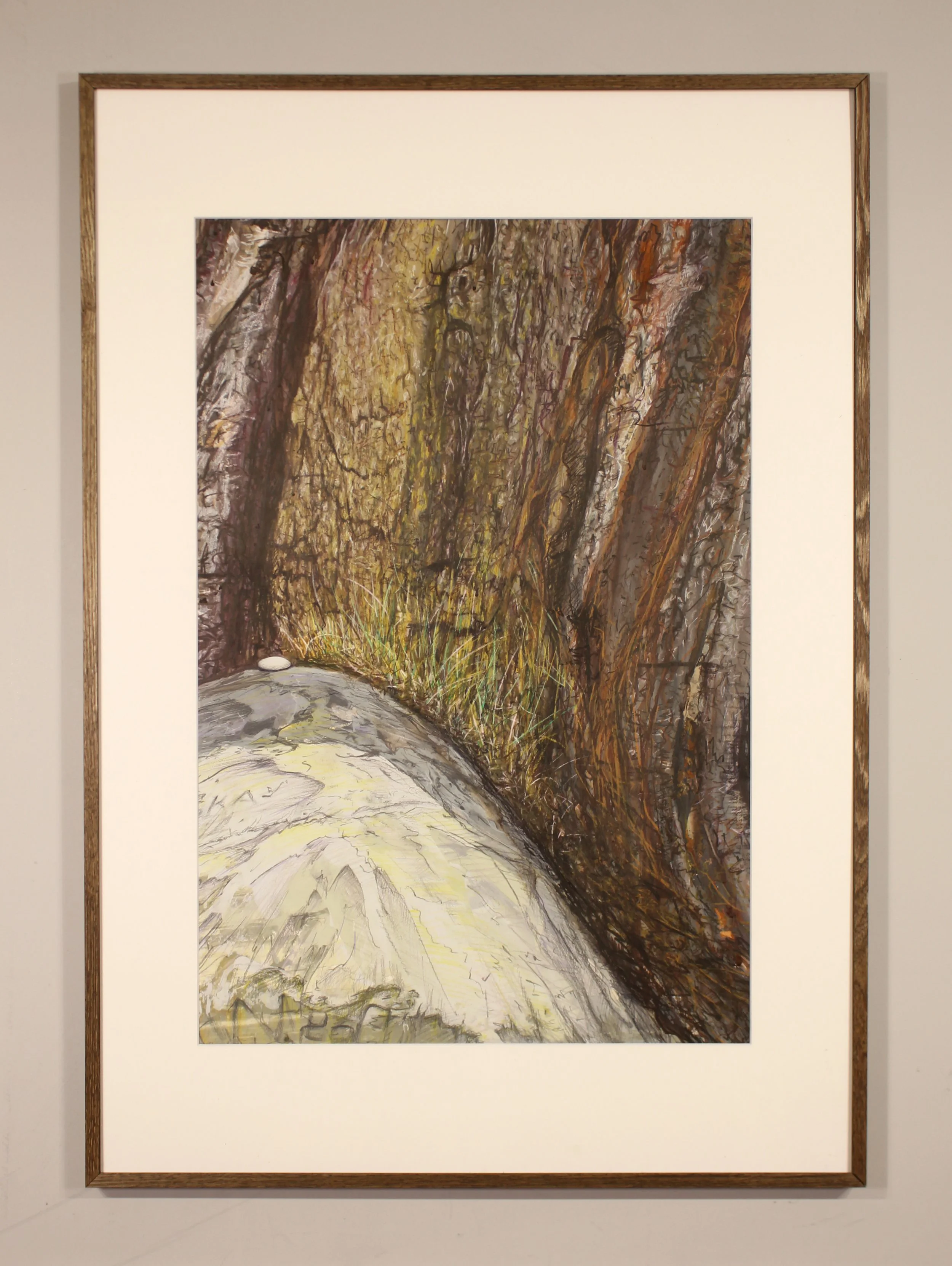 A detailed figurative drawing of the natural elements of cliff face on the rocky shoreline at Chale Bay on the Isle of Wight. The brown and rusty sodden earth mixed with the rock collapses onto the beach mixed with large boulders of chalk deposited a