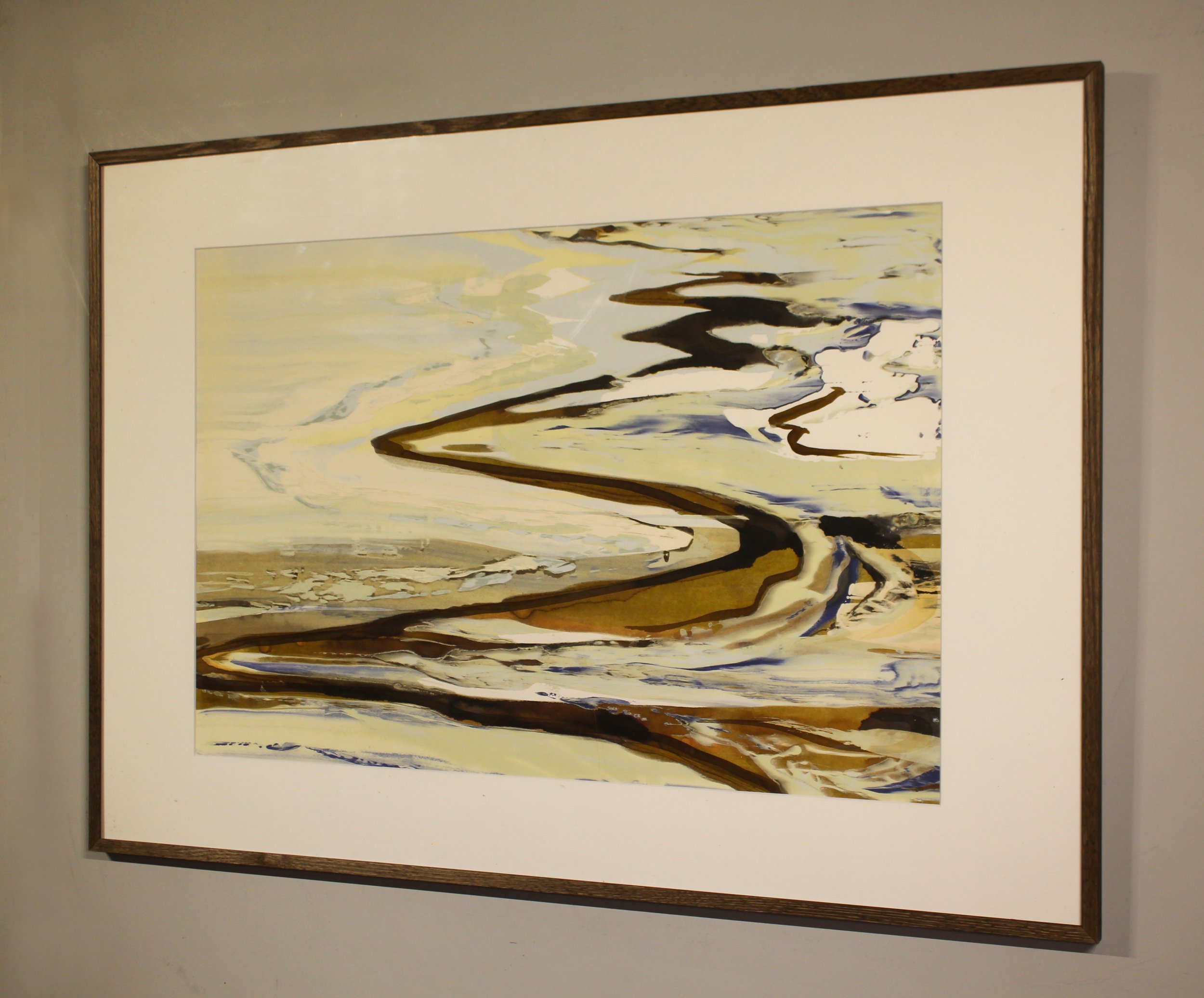 An abstracted ink painting that suggests waves depositing into to the beach. Paint and ink has been poured, seeped and dripped onto the surface in a calligraphic style with earth tones, frothy lemon whites and deeper slate grey tones.