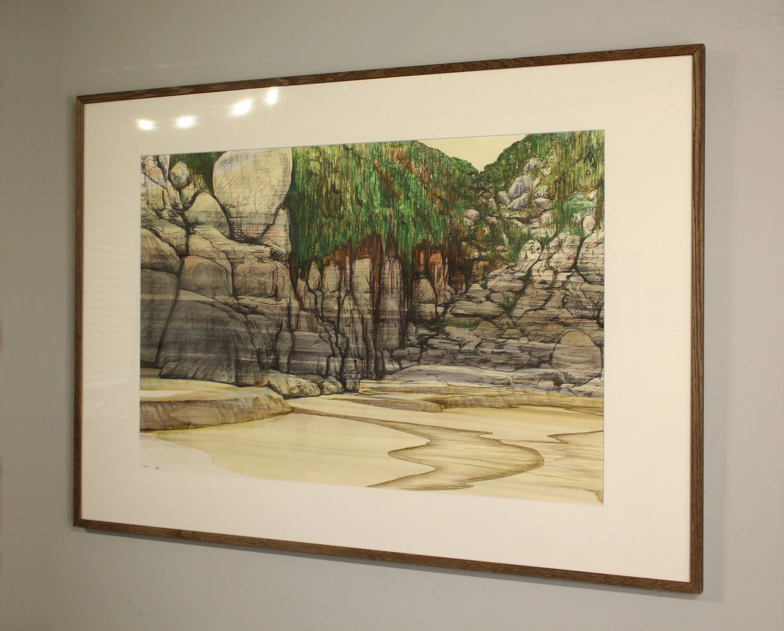 At the back of Porthchapel beach, a river arrives on the beach carving intricate fluid patterns in the sand. Soaring rounded rocks of the cliffside behind are loosely drawn with more expressive mark making foir the foliage hanging onto the side of th