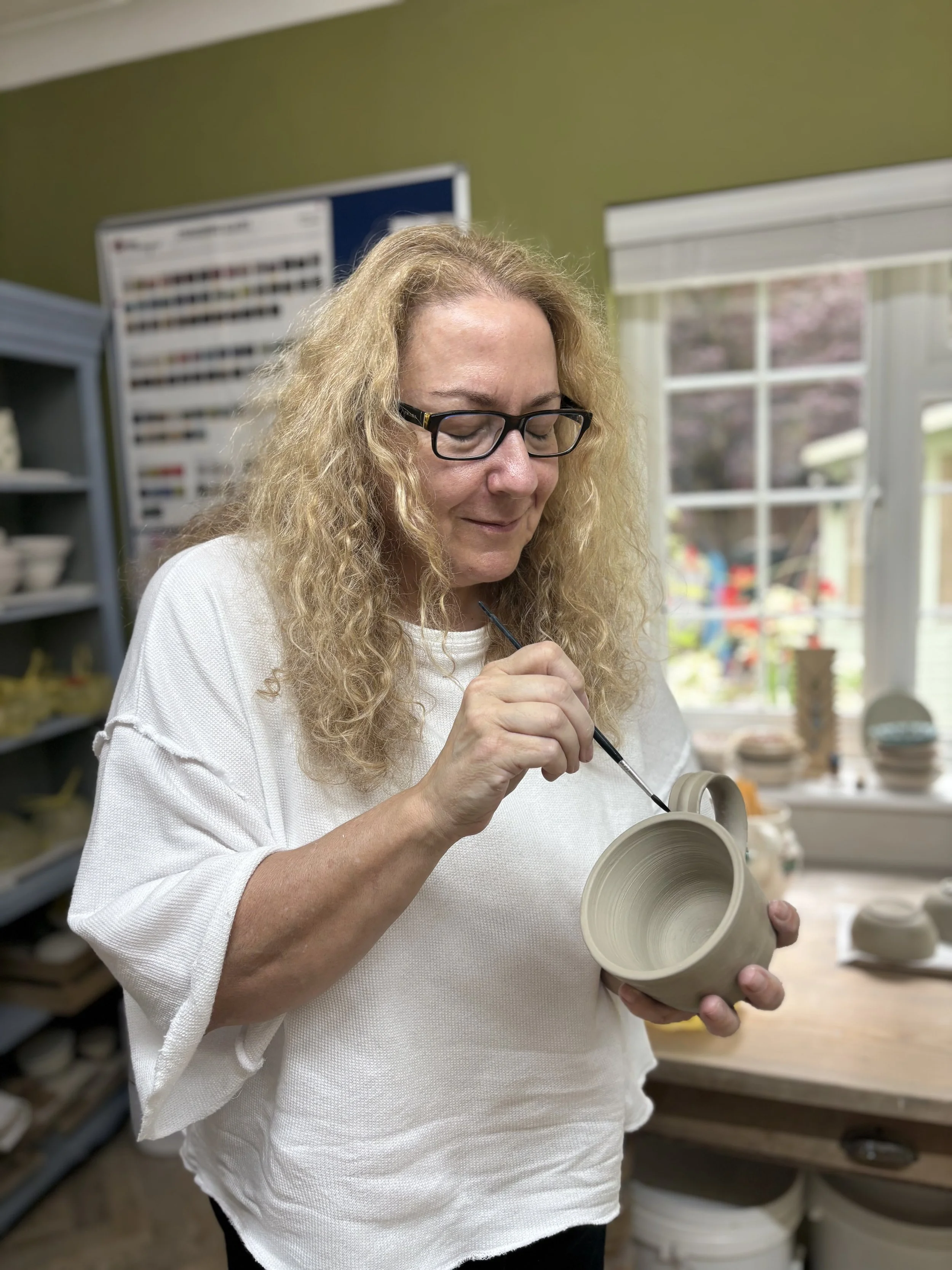 Sam has been learning to trim her pieces and has added a handle to her mug!