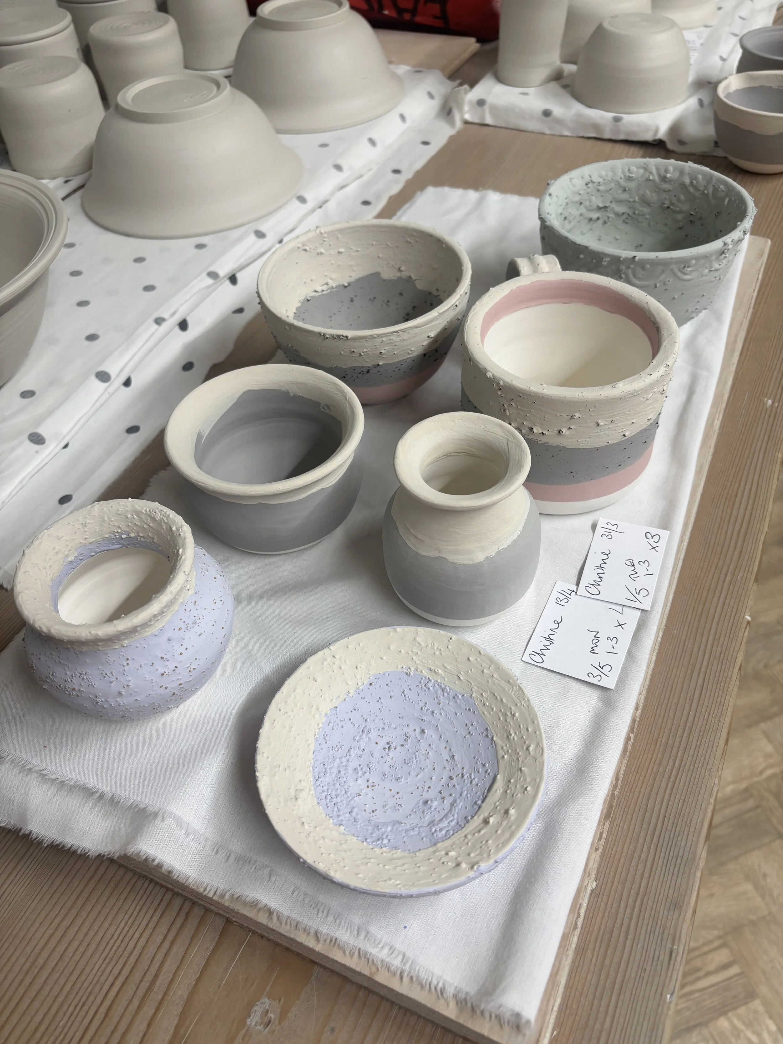   
 Christine's glazed pieces before firing ... 
 