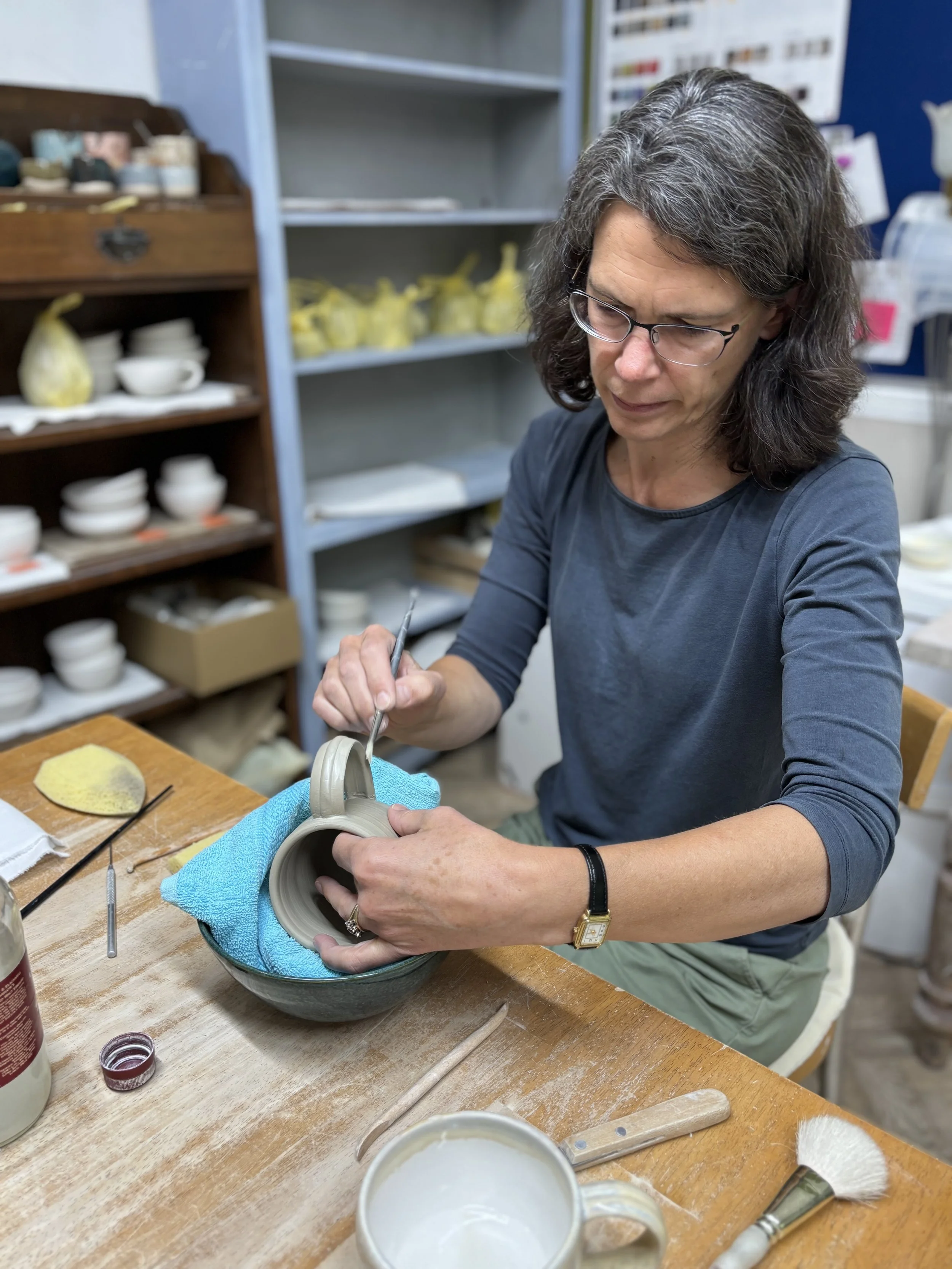 Elly has been trimming her first pieces and adding handles to her mugs!