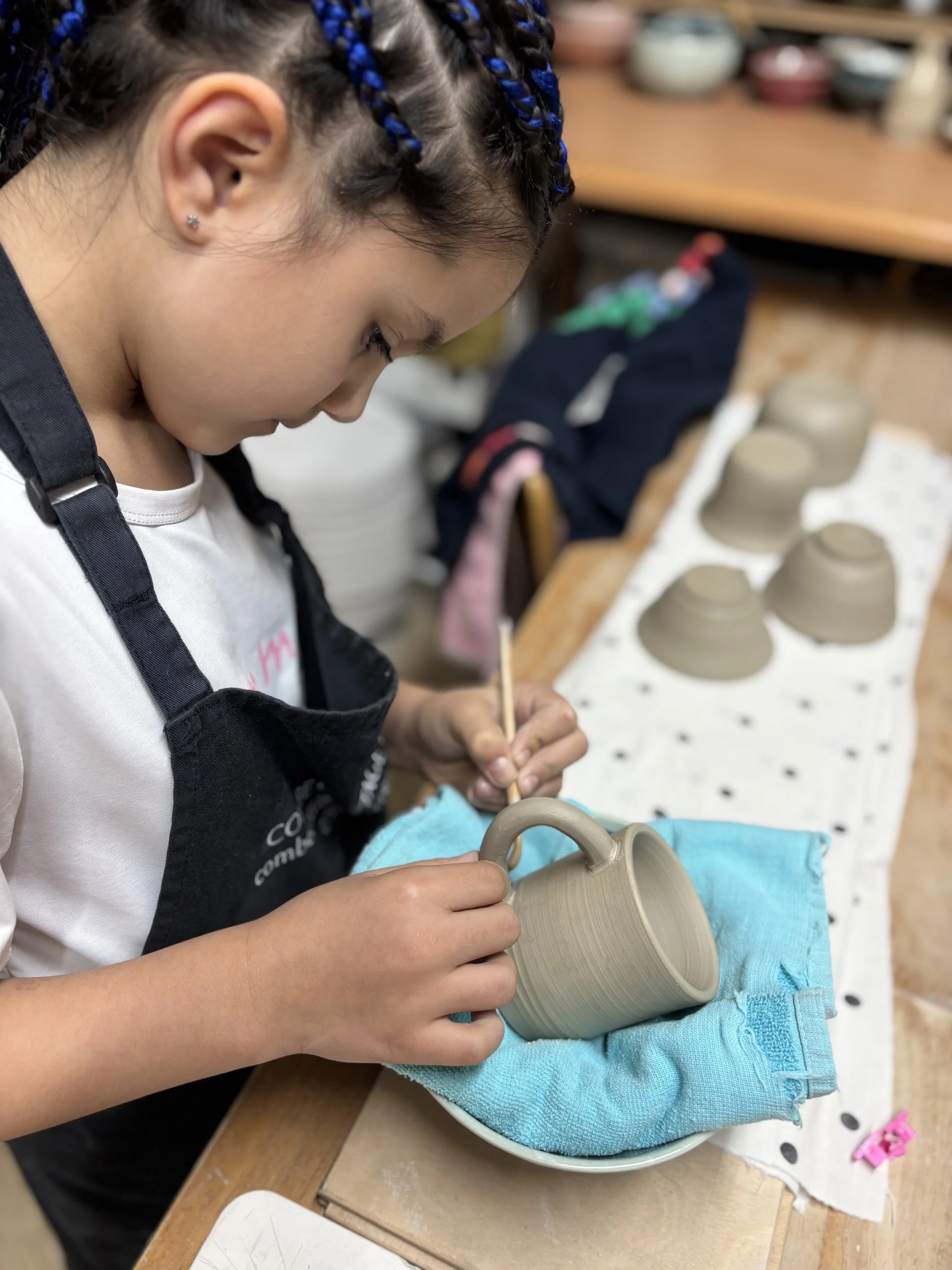   
 Ava did a great job trimming her pieces & attaching a handle to her little mug!  
 