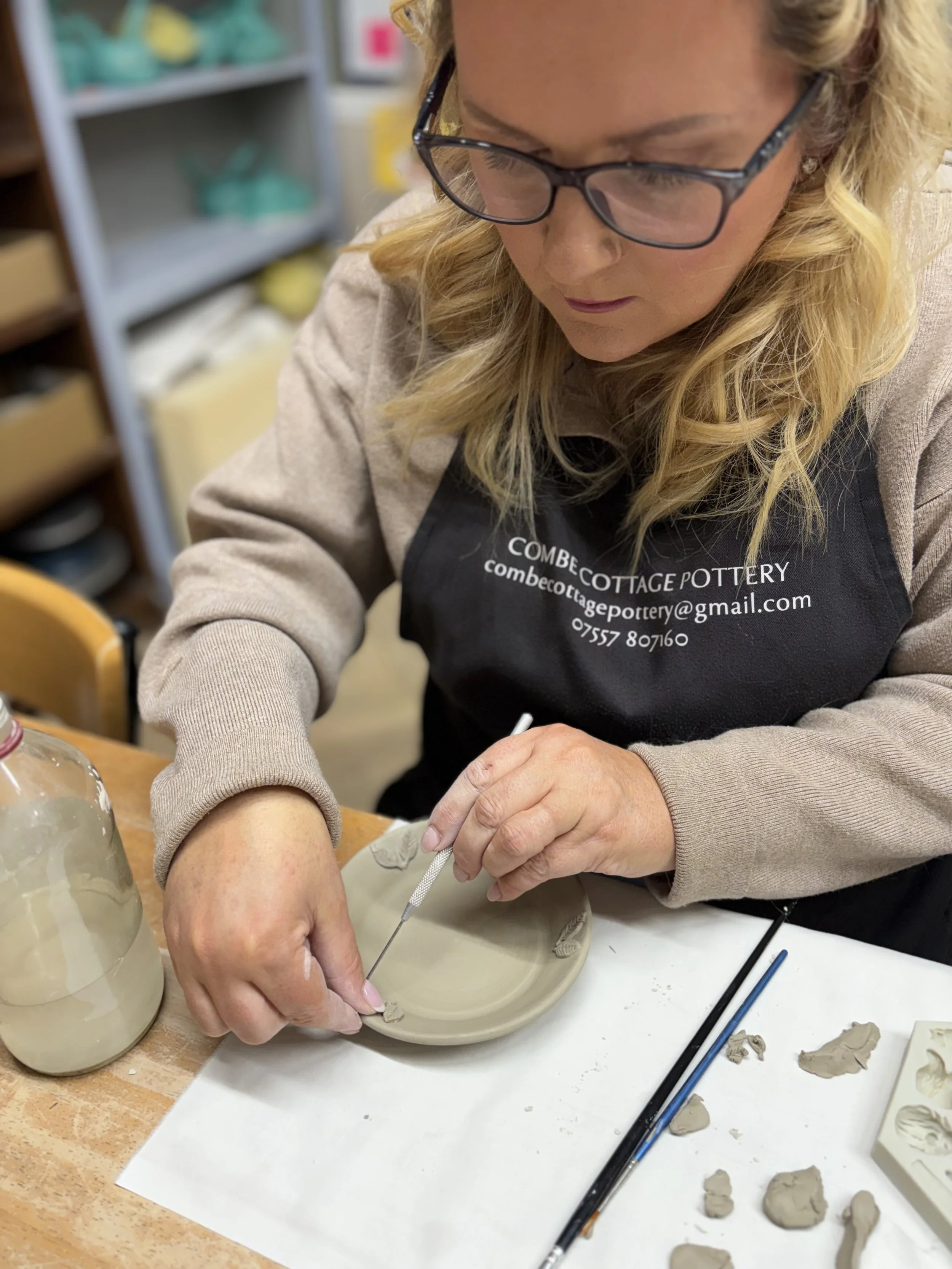   
 ... Mel has been adding sprigs to decorate some of her pieces ... 
 