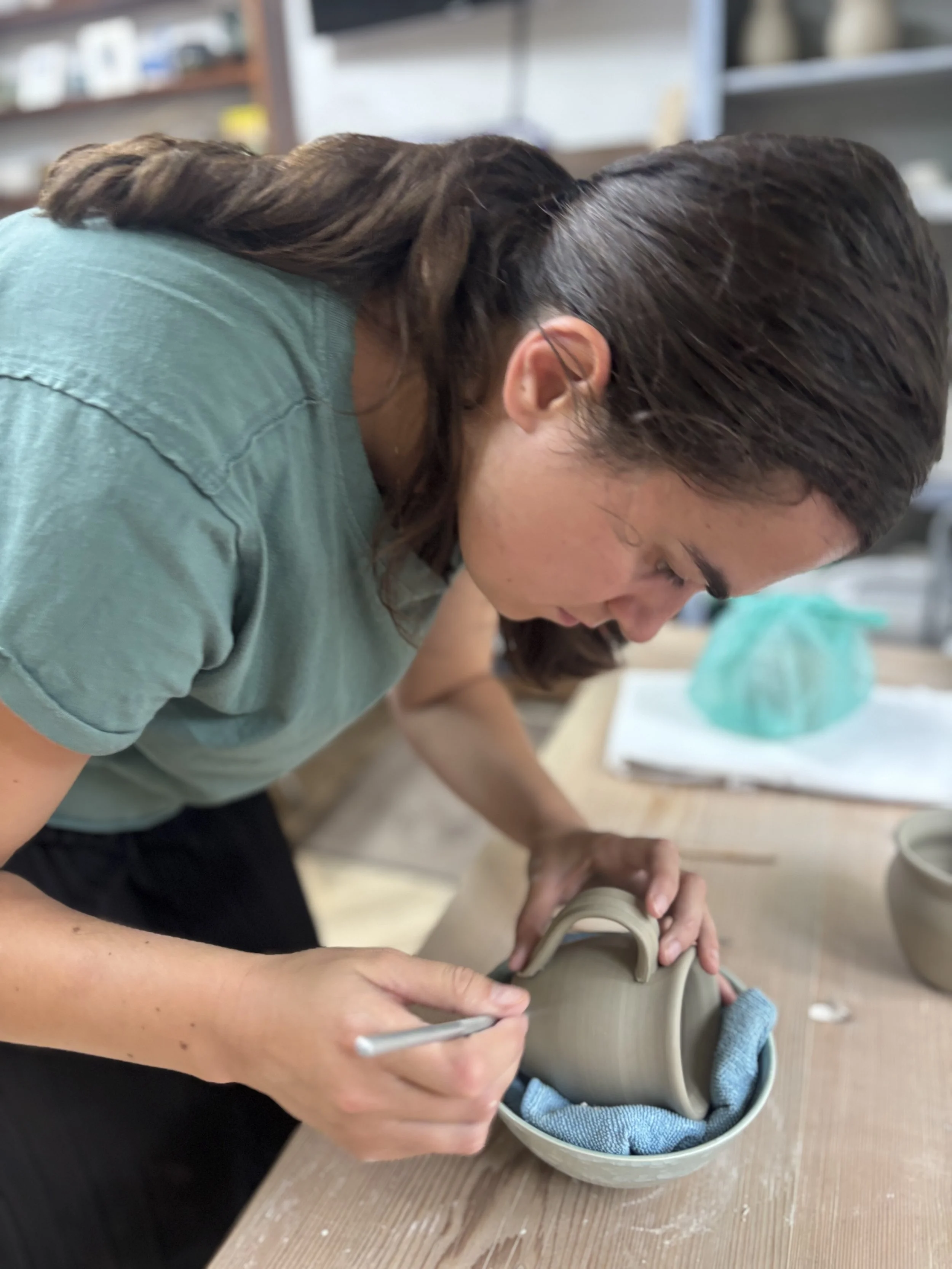   
 Lizzie has been adding her handles to her latest set of mugs ... 
 