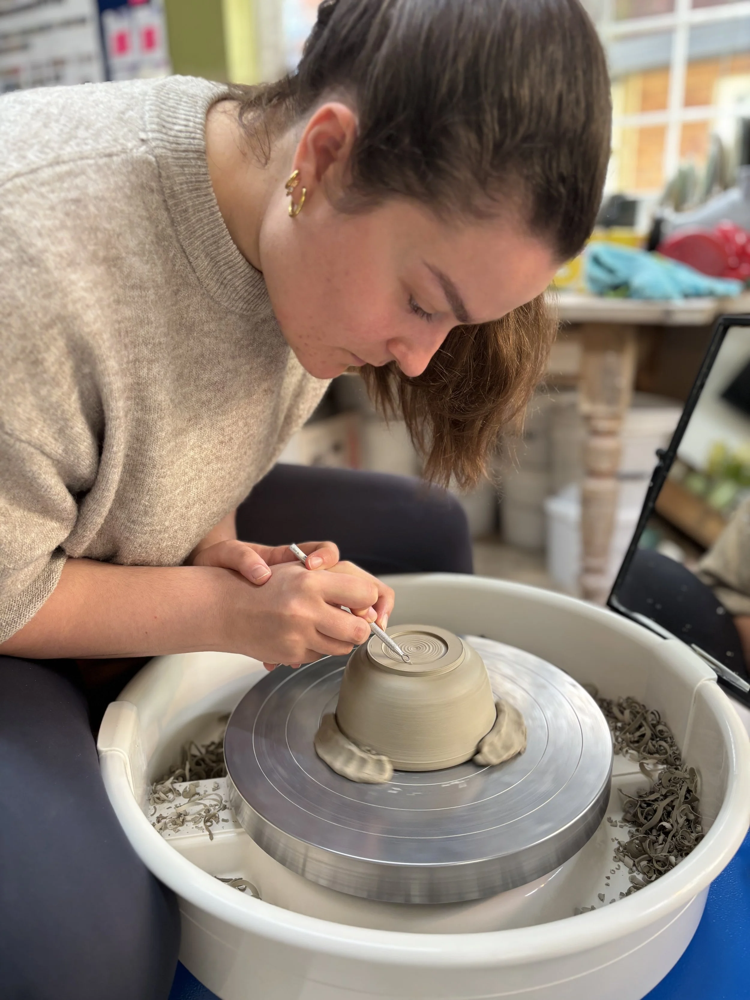   
 A morning of trimming for Jenny on her 'Throw, Turn & Glaze Experience'! 
 