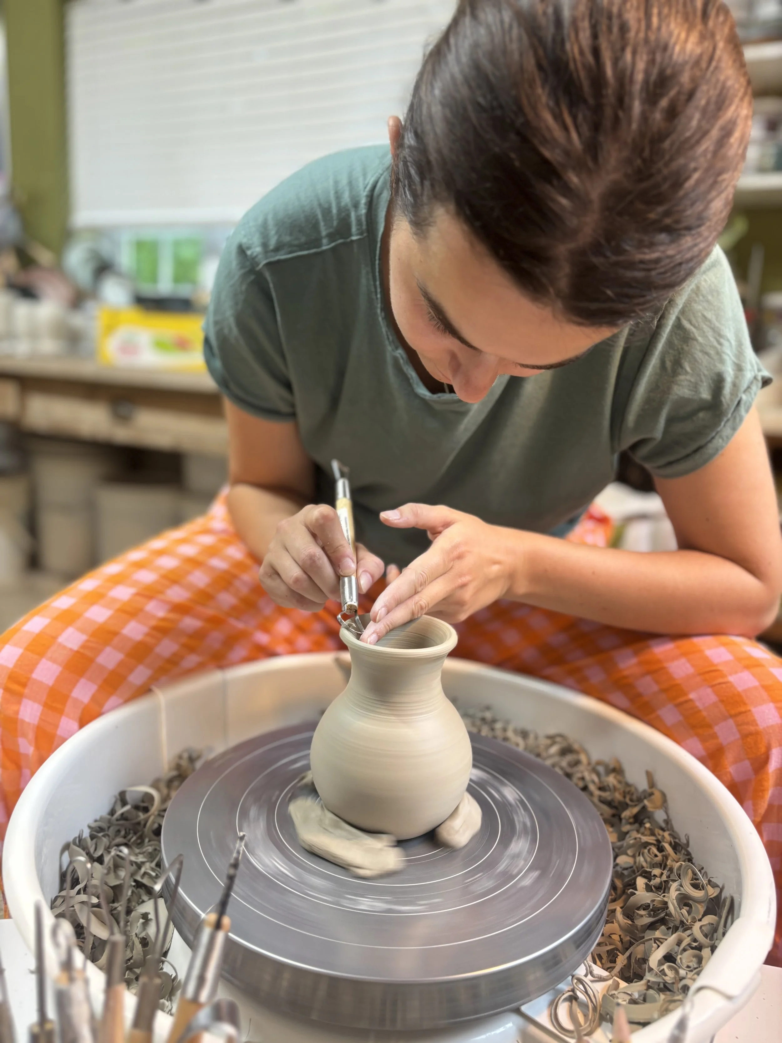   
  Ellie has been trimming & choosing her glazing for her next session! 
 