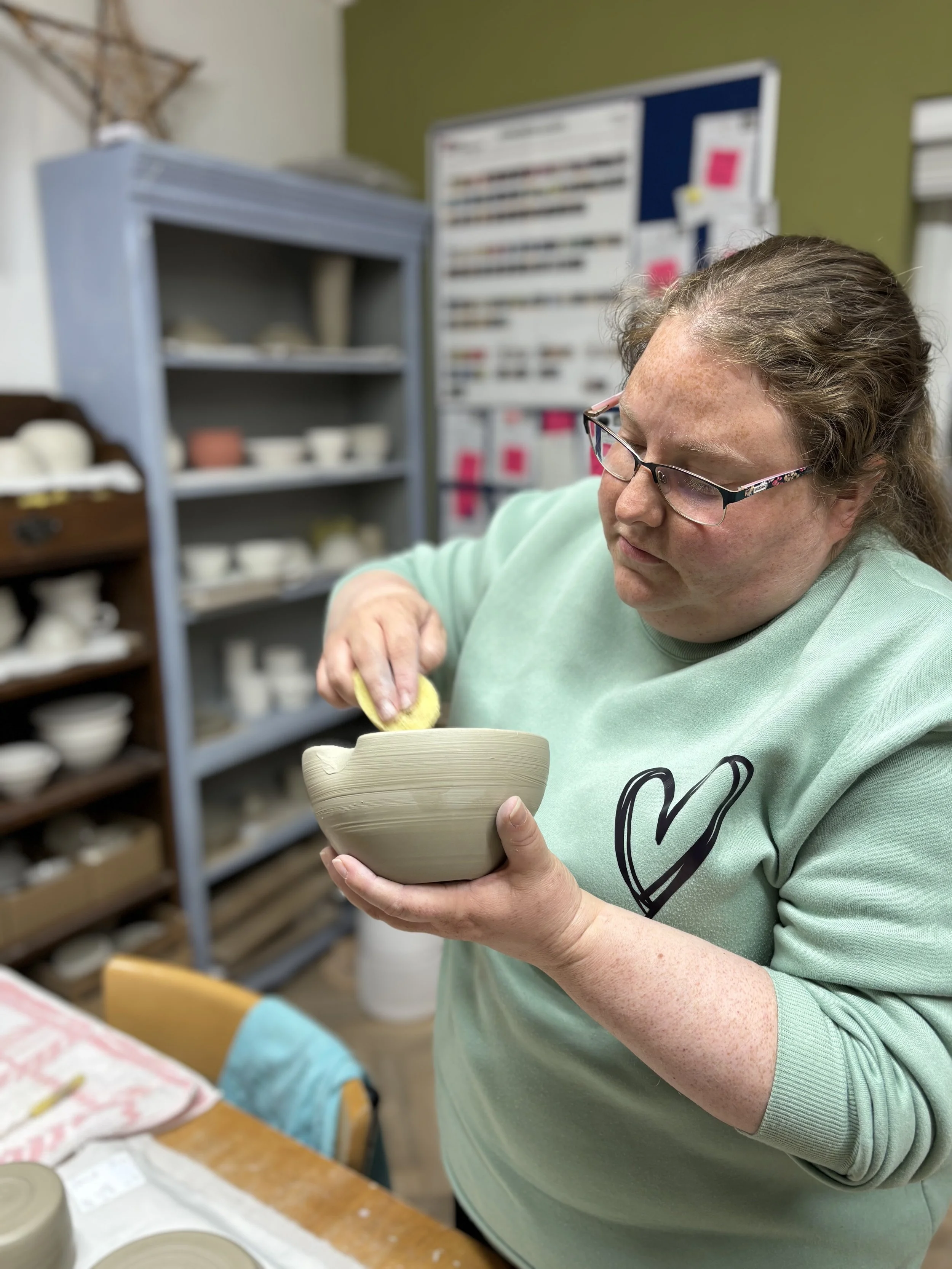 ... & cleaning up the rims & choosing their glazes for their final session!