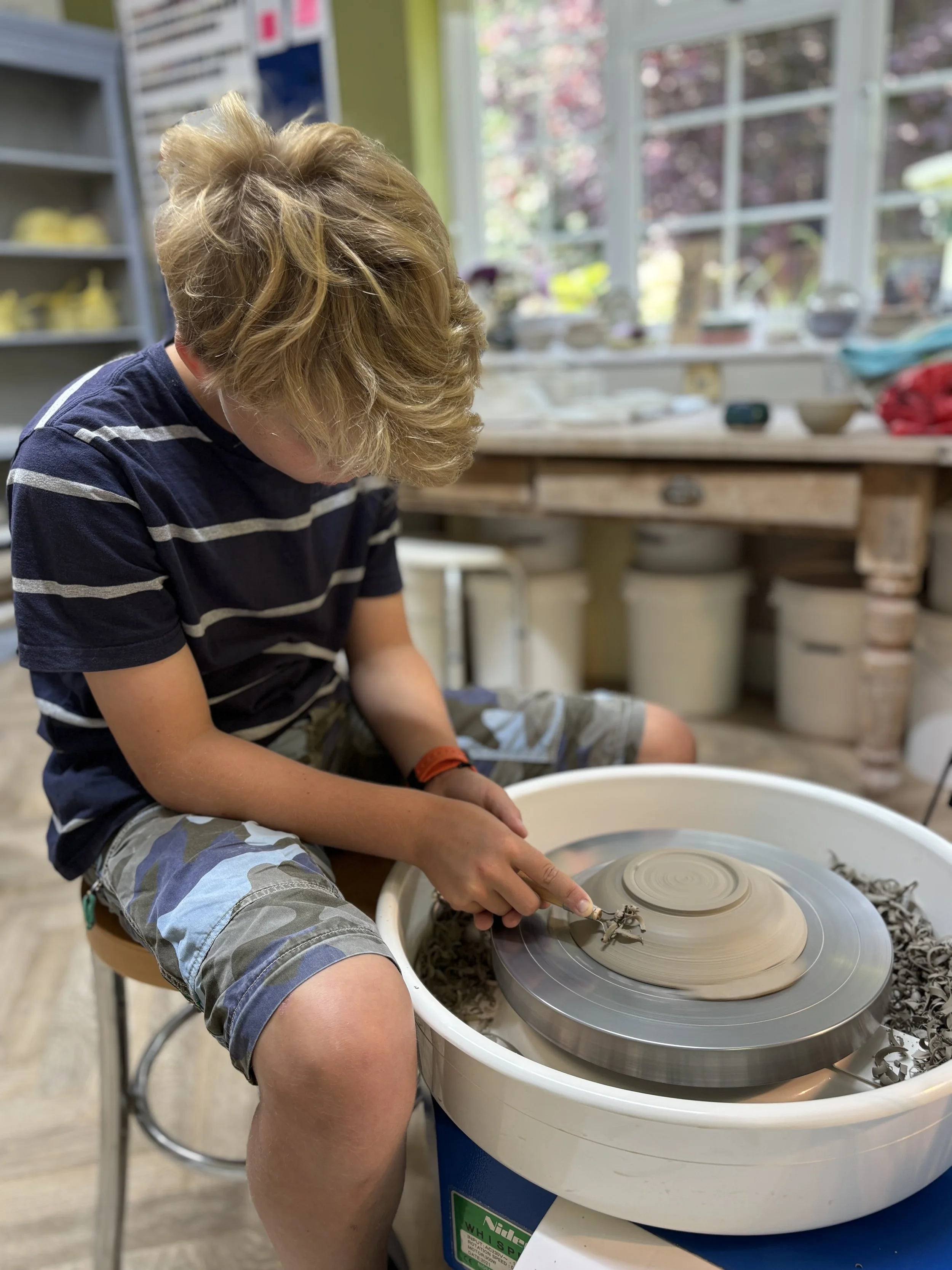 Wilfred has done a super job trimming his pieces & chosen his glazing for his final session!