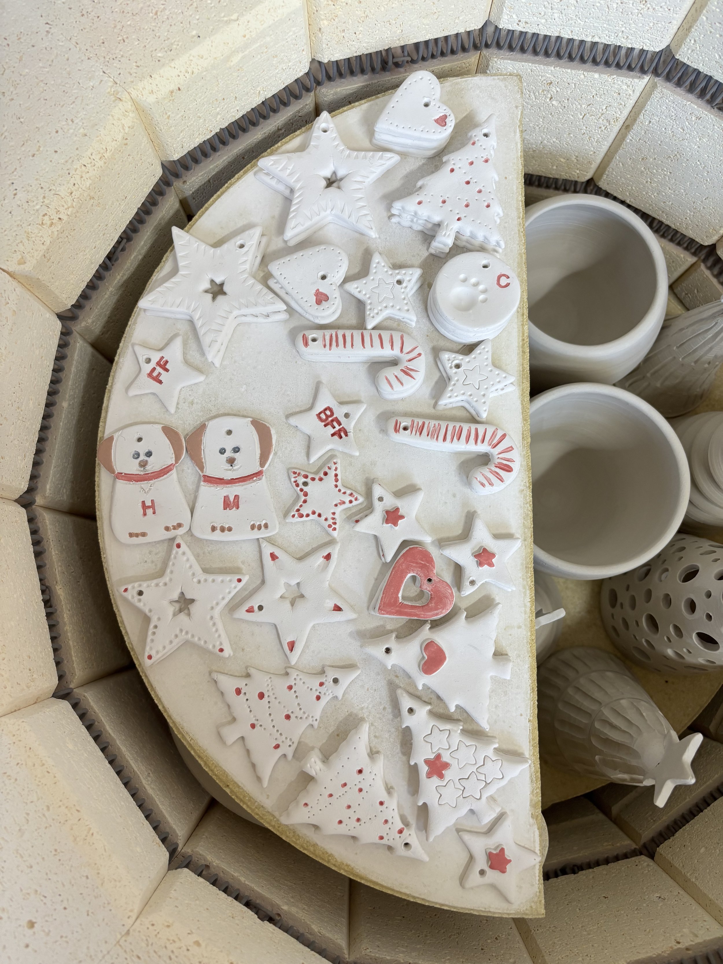   
 Michelle & Karen's porcelain pieces in the kiln!   
 