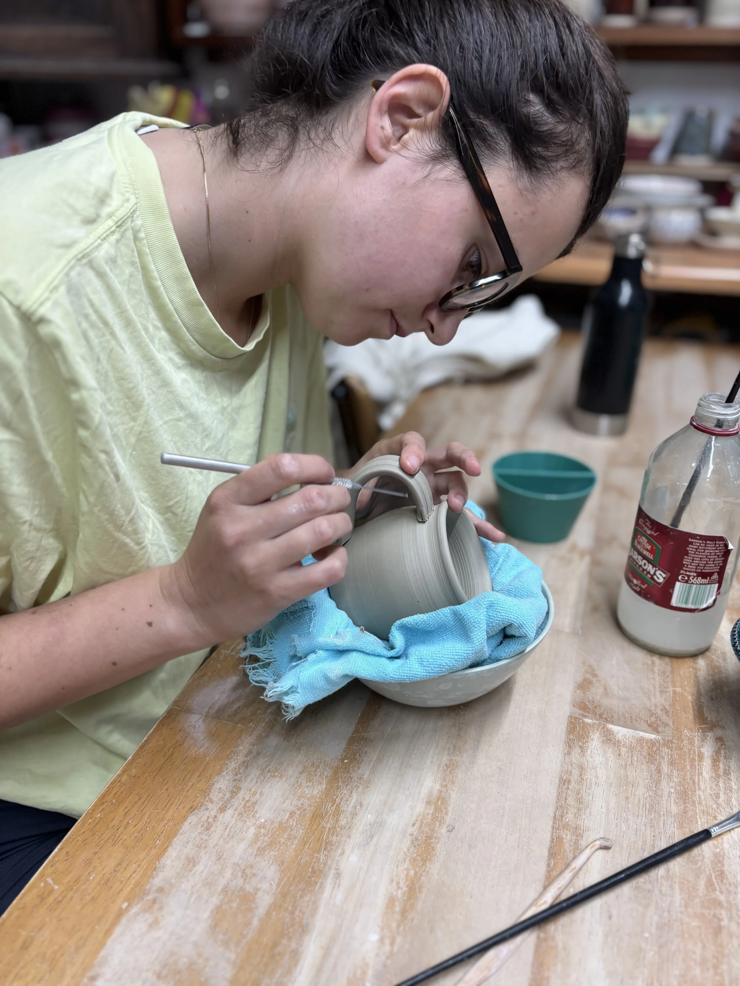   
 Izzie has been trimming her bases & adding handles to her three little mugs!  
 