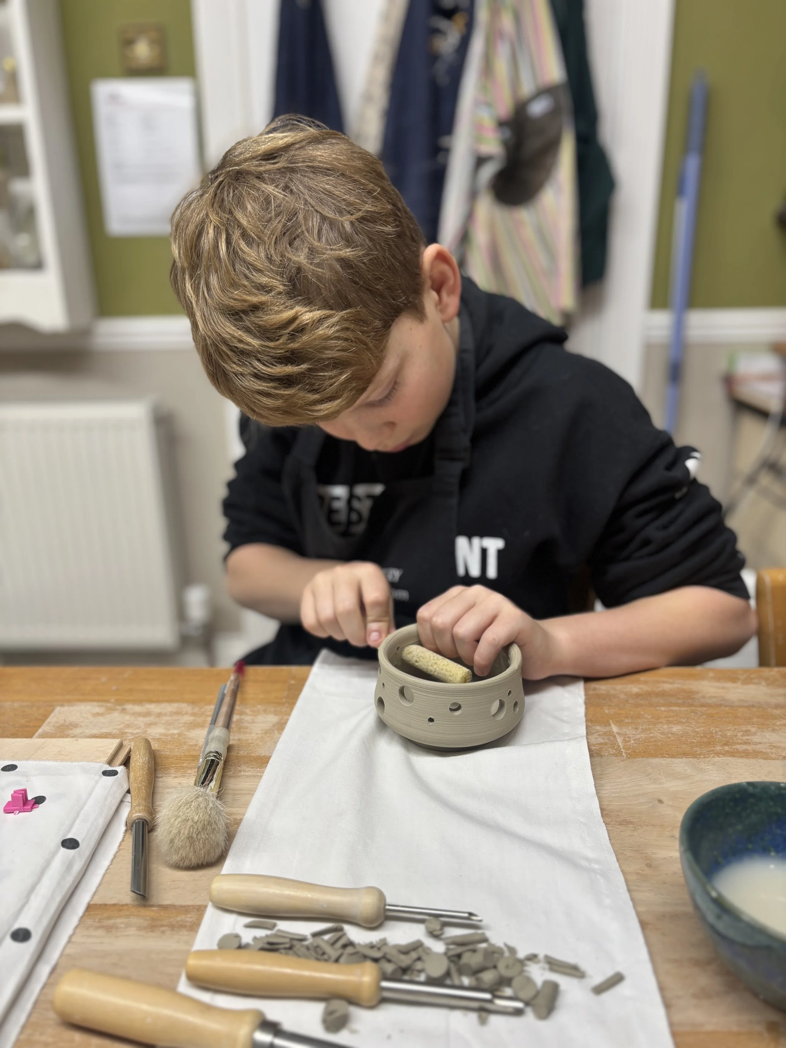   
 Wilfred has been trimming his pieces,  carving walls on one 
& adding holes to another to make a luminaire!  
 