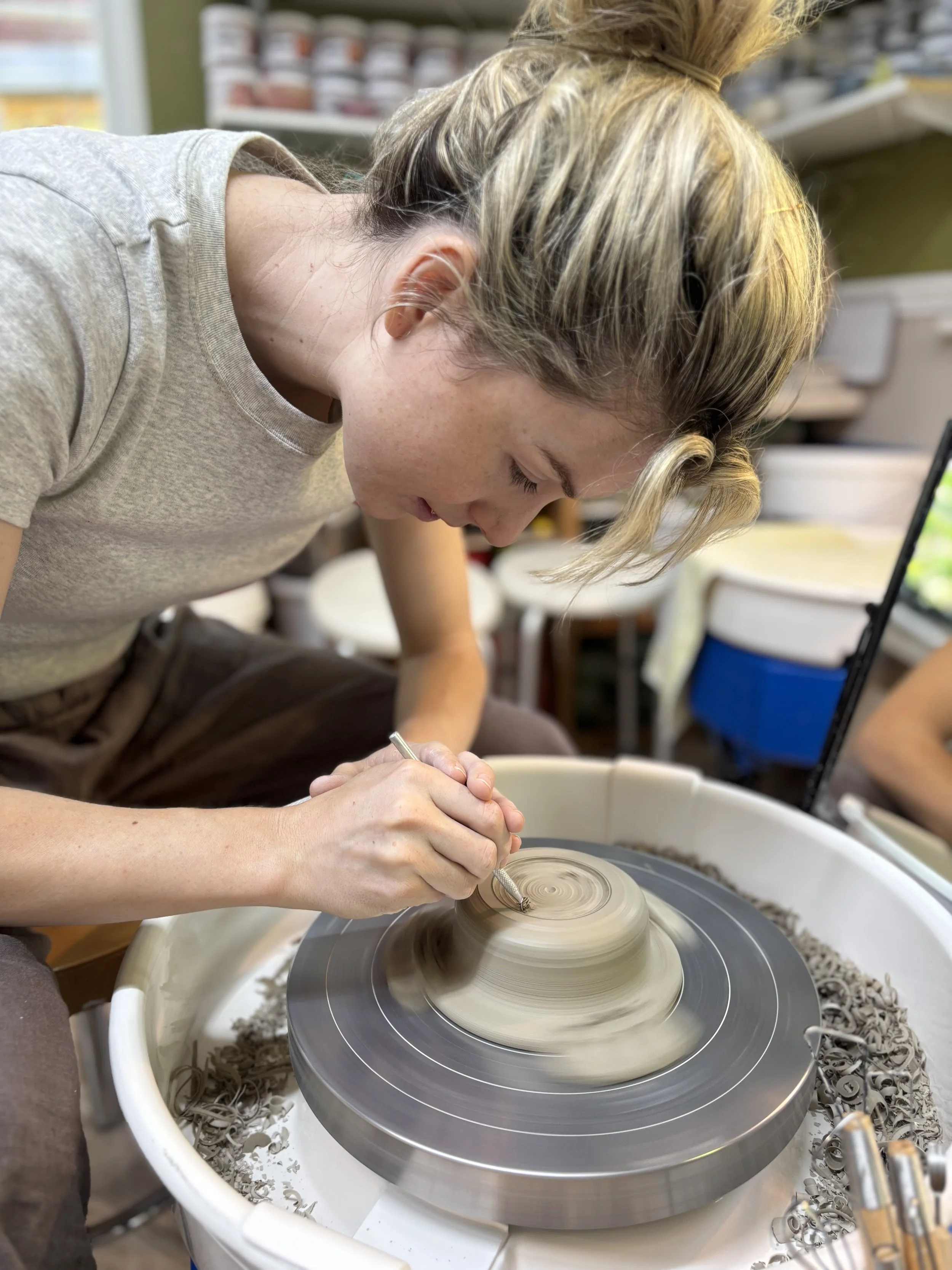   
 Emma has been trimming her final pieces ready for their bisque fire! 
 