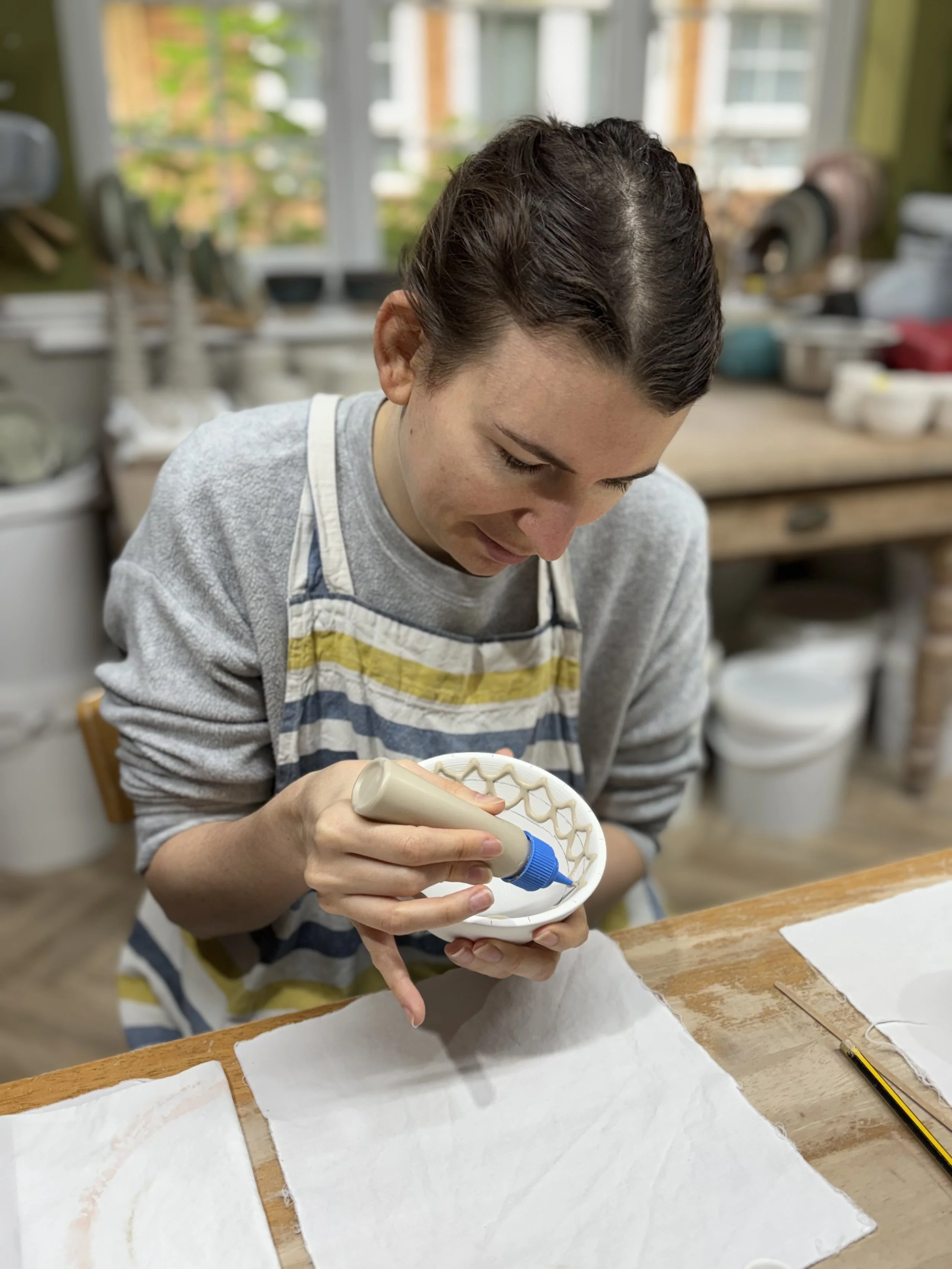   
 Hayley returned to glaze her pieces with her mum... 
 