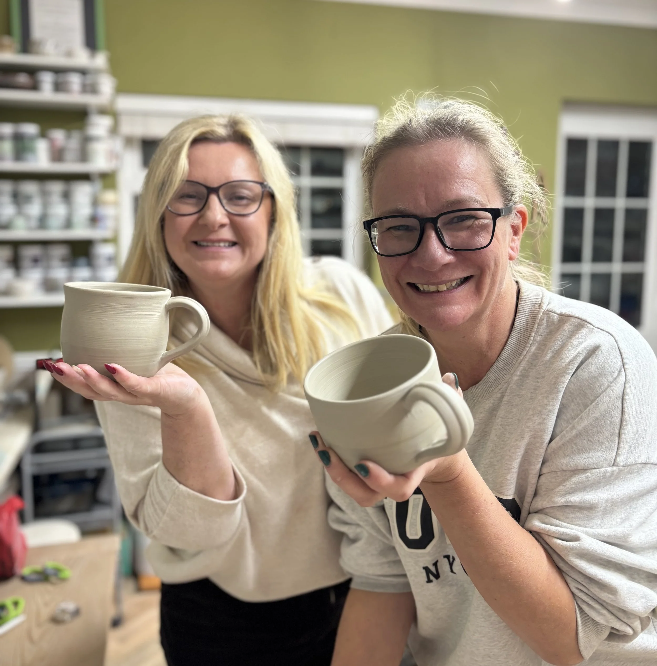   
 Lisa & Mel had a super evening on their 5 week course - trimming their pieces & adding handles to their mugs! 
 