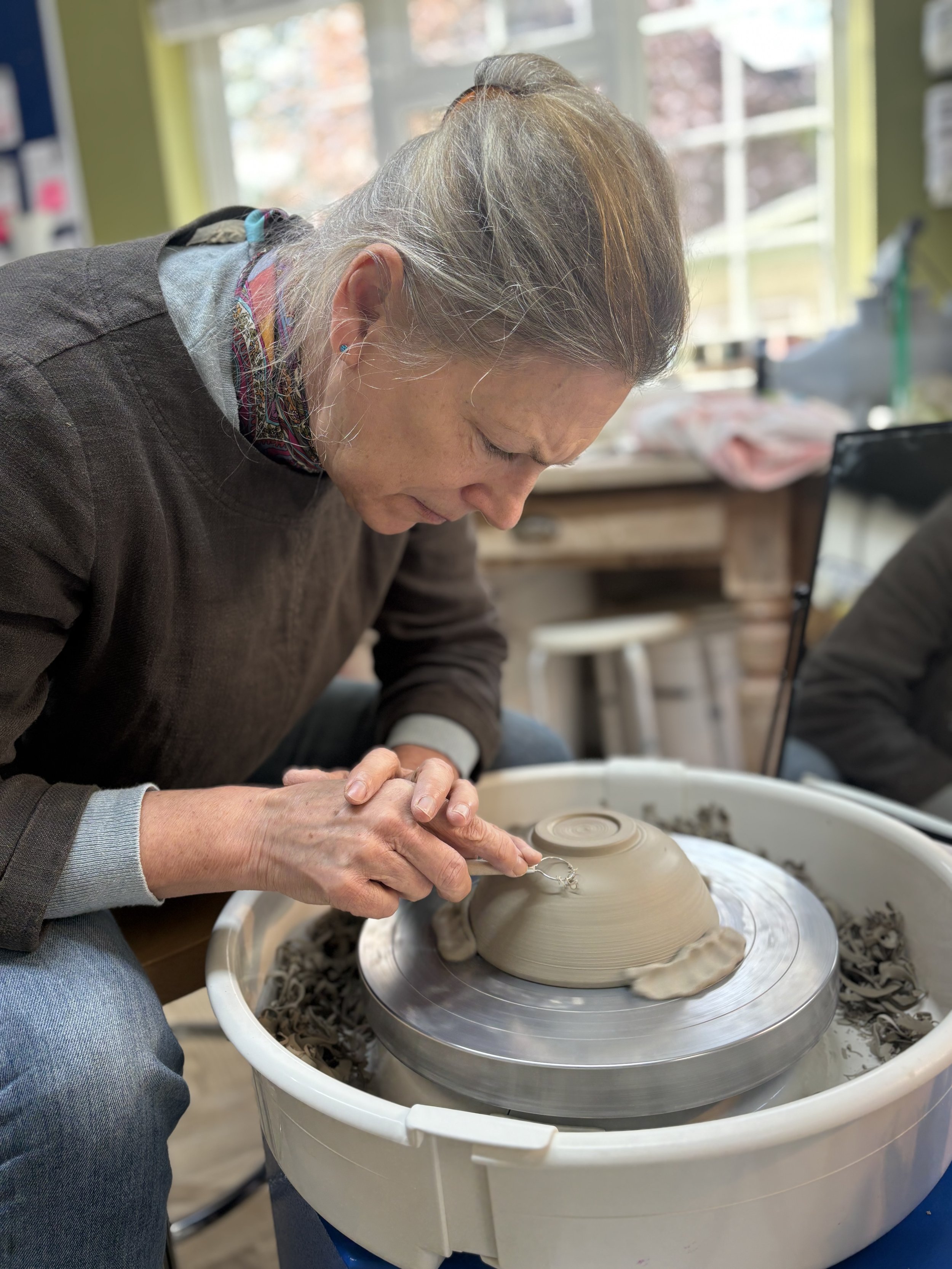 Julie has been trimming her final pieces and choosing her glazing for her final session!