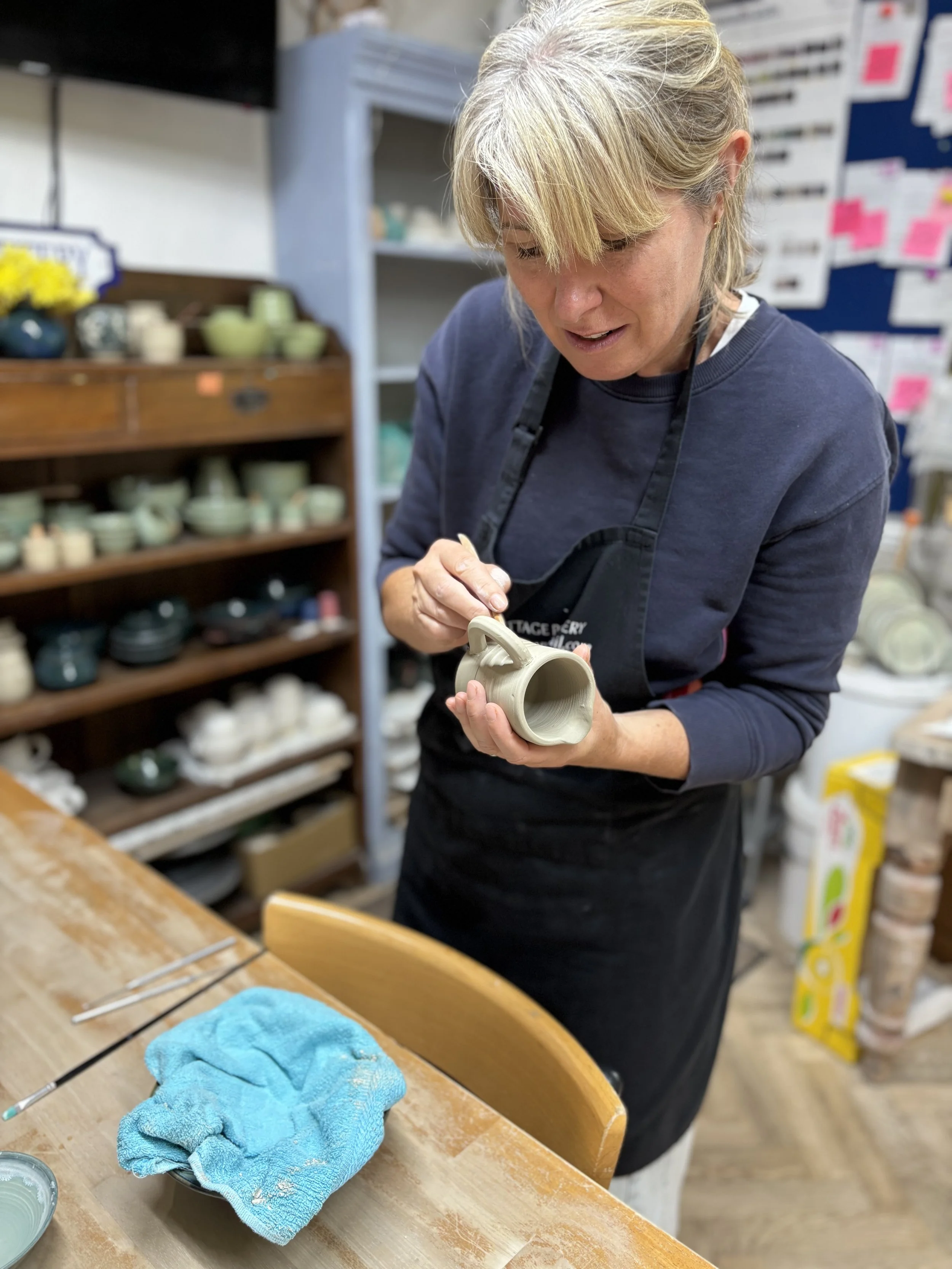   
 Rachel has been trimming her first pieces and adding a handle to her little jug! 
 