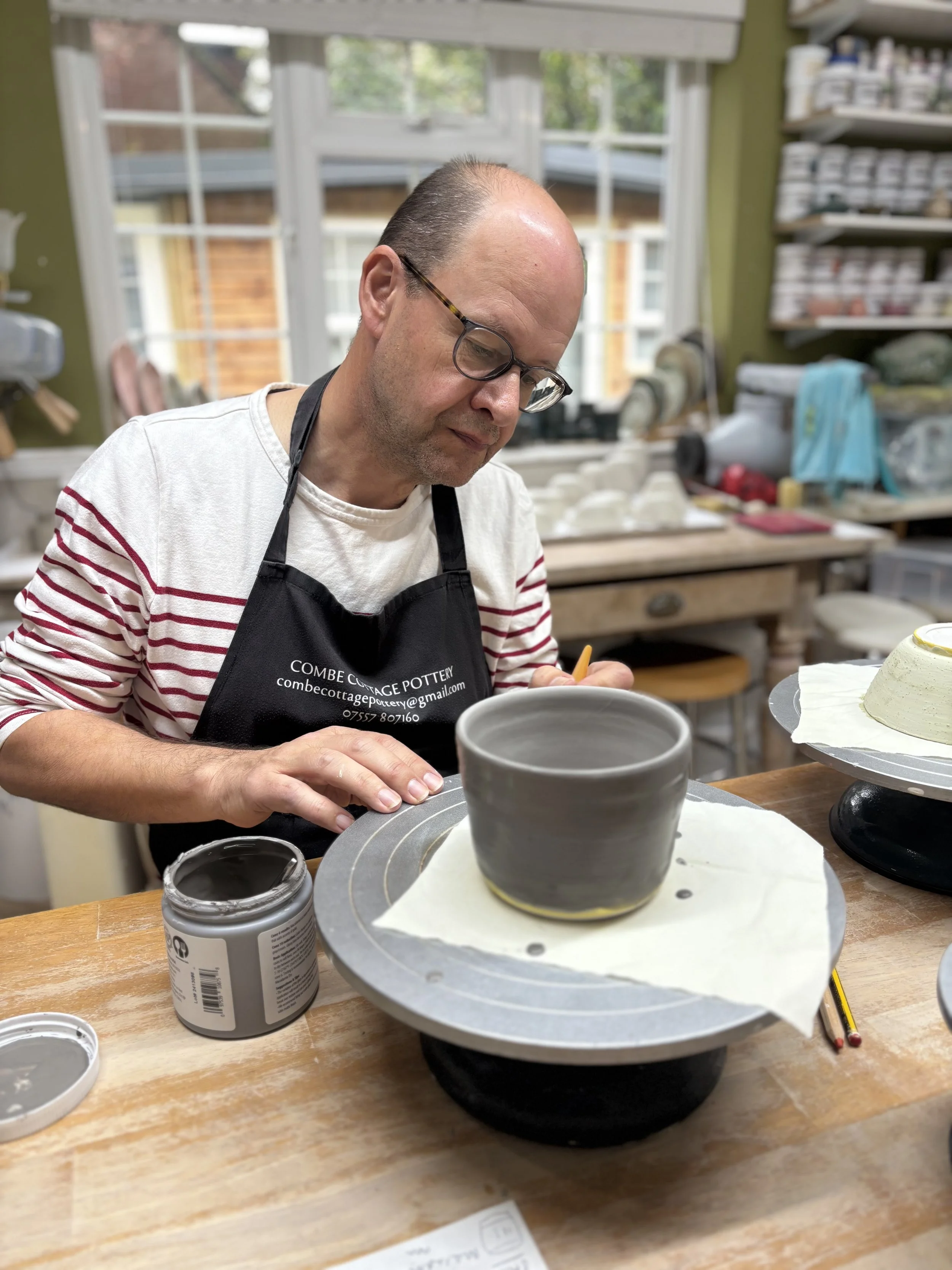   
  Glazing session for Steve at the end of his 'Throw, Turn & Glaze experience'! 
 