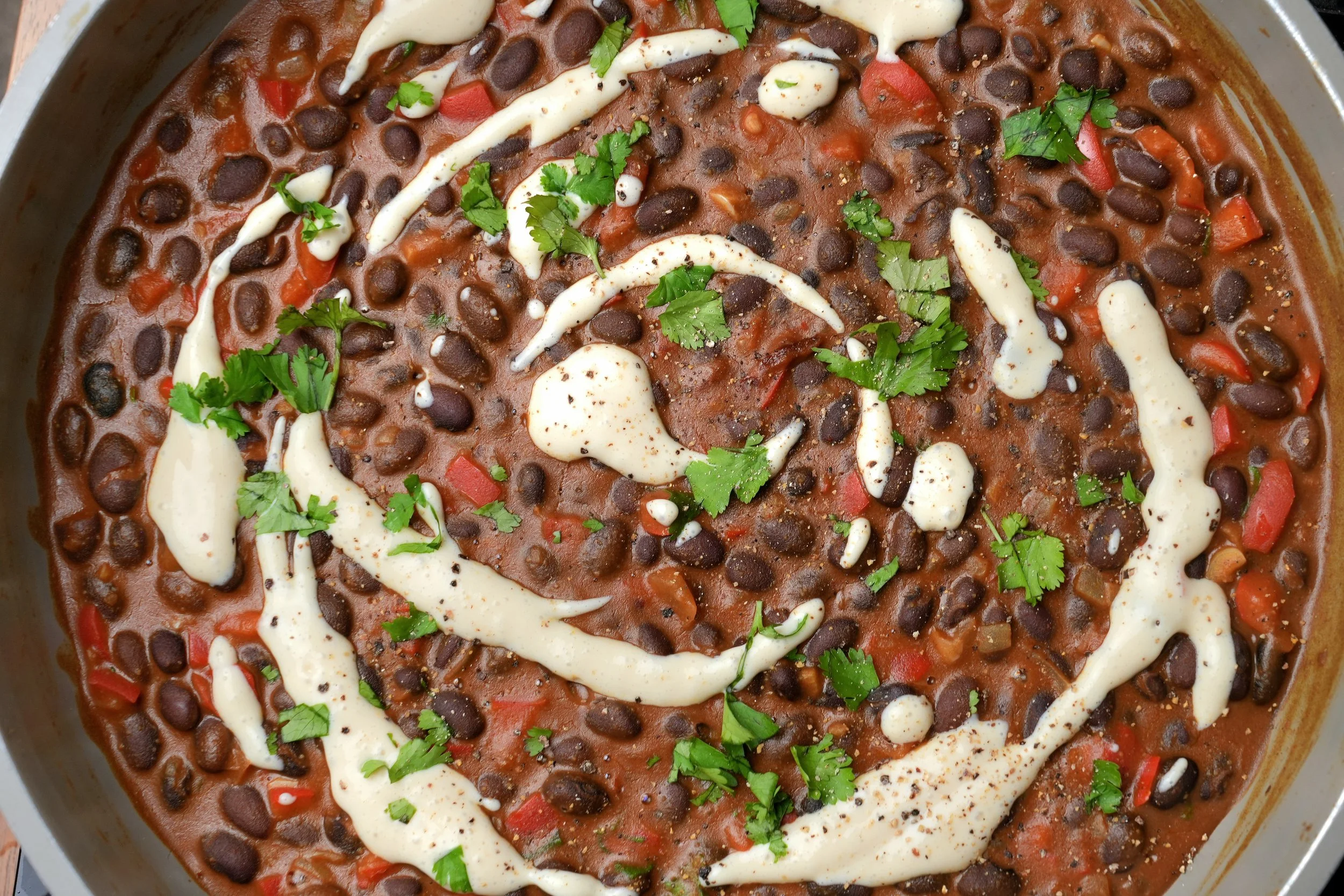 image of creamy high protein peanut butter black beans with silken tofu cream vegan plant based high fibre meal prep batch cook friendly