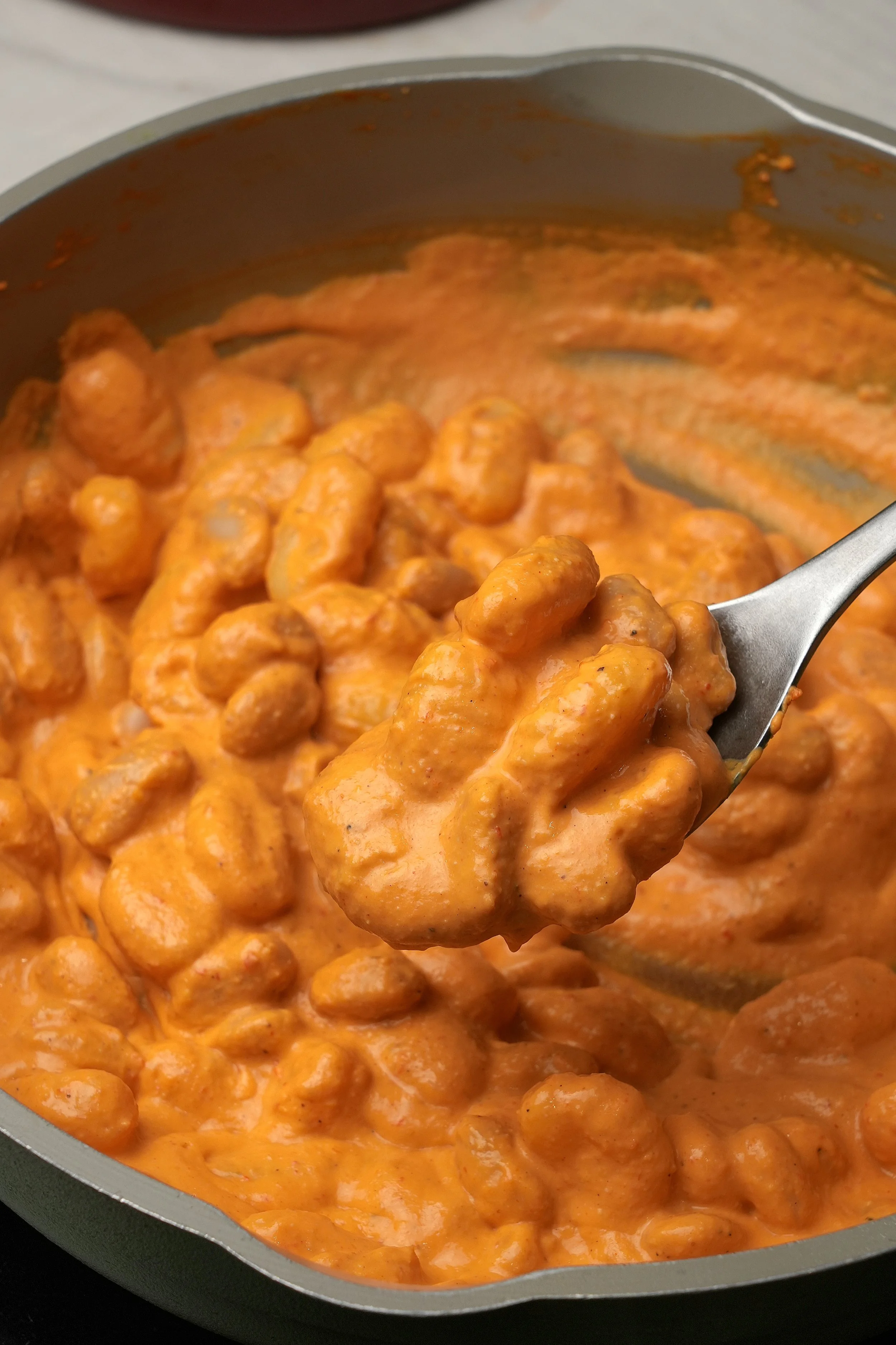 image of vegan high protein high fibre roasted pepper gnocchi in pot