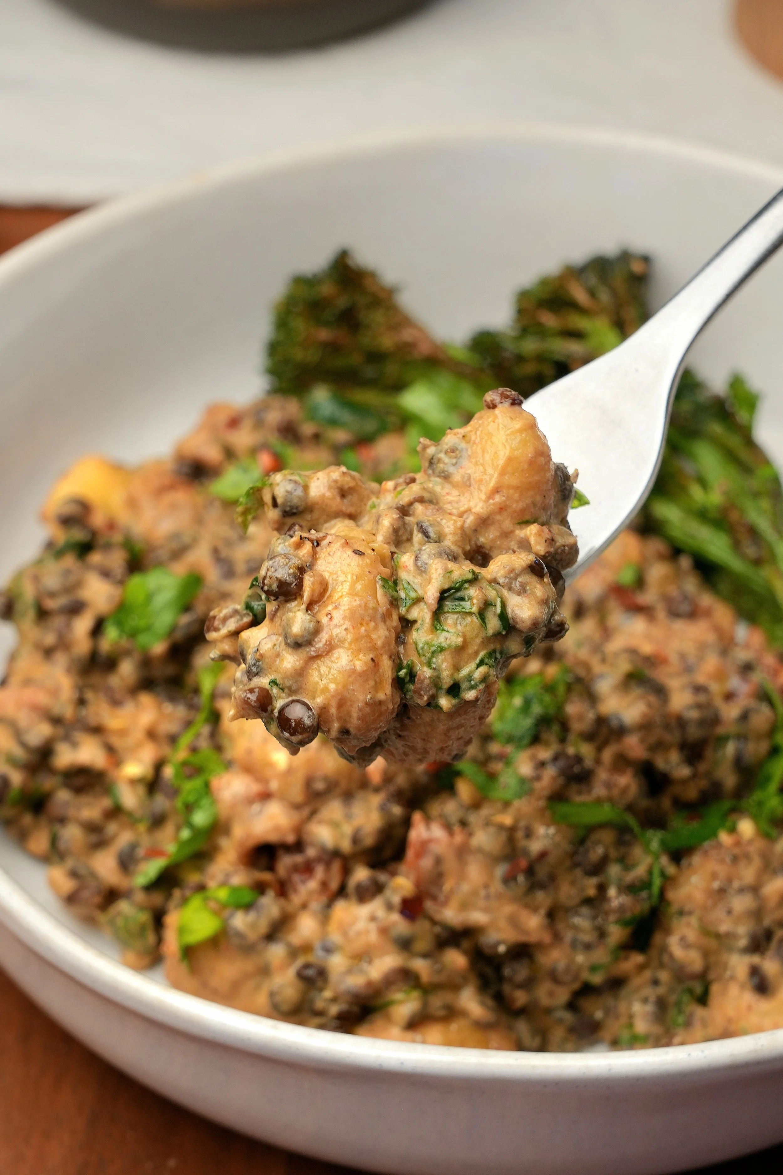 Image of marry me puy lentils with sundried tomatoes and spinach high protein high fibre vegan plant based batch cook meal prep friendly with gnocchi