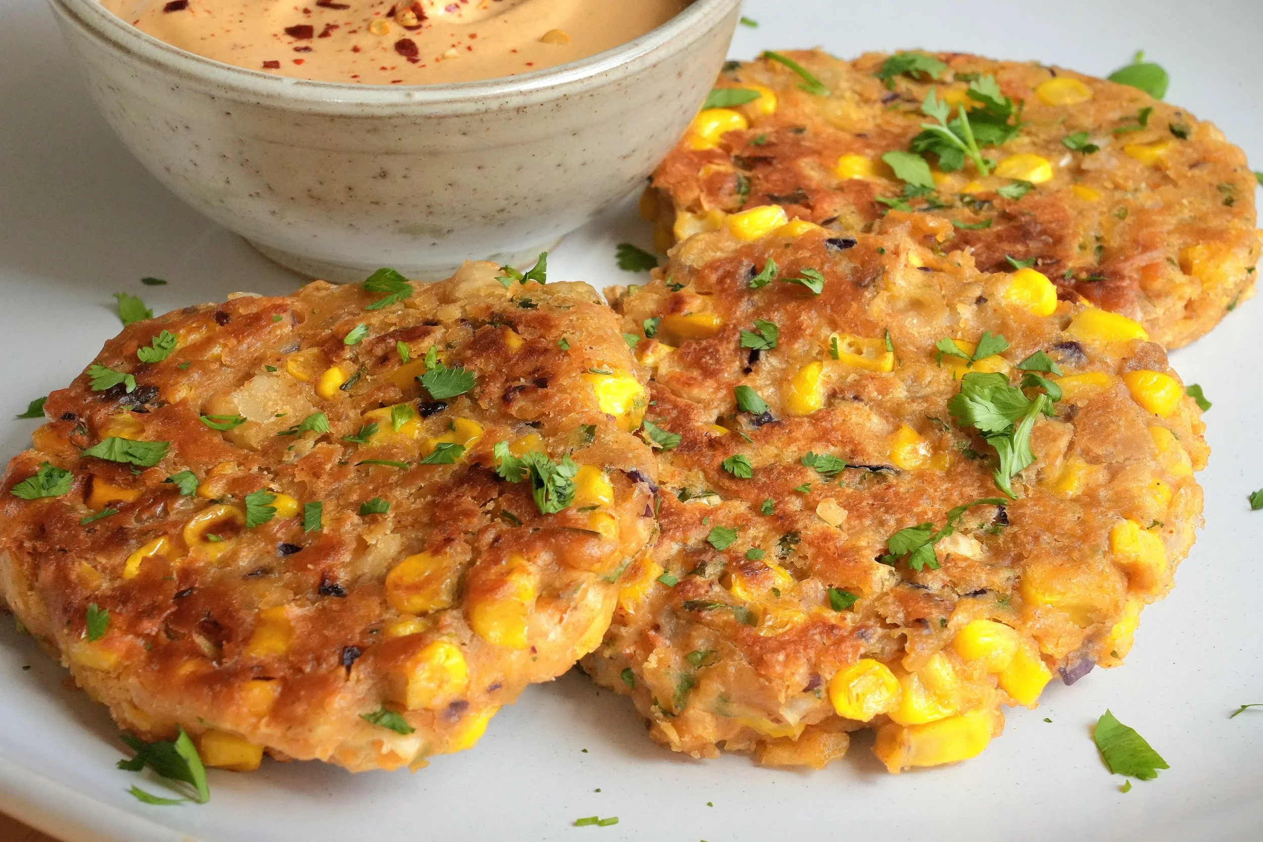 image of sweetcorn and white bean fritters recipe with a chipotle cashew cream recipe