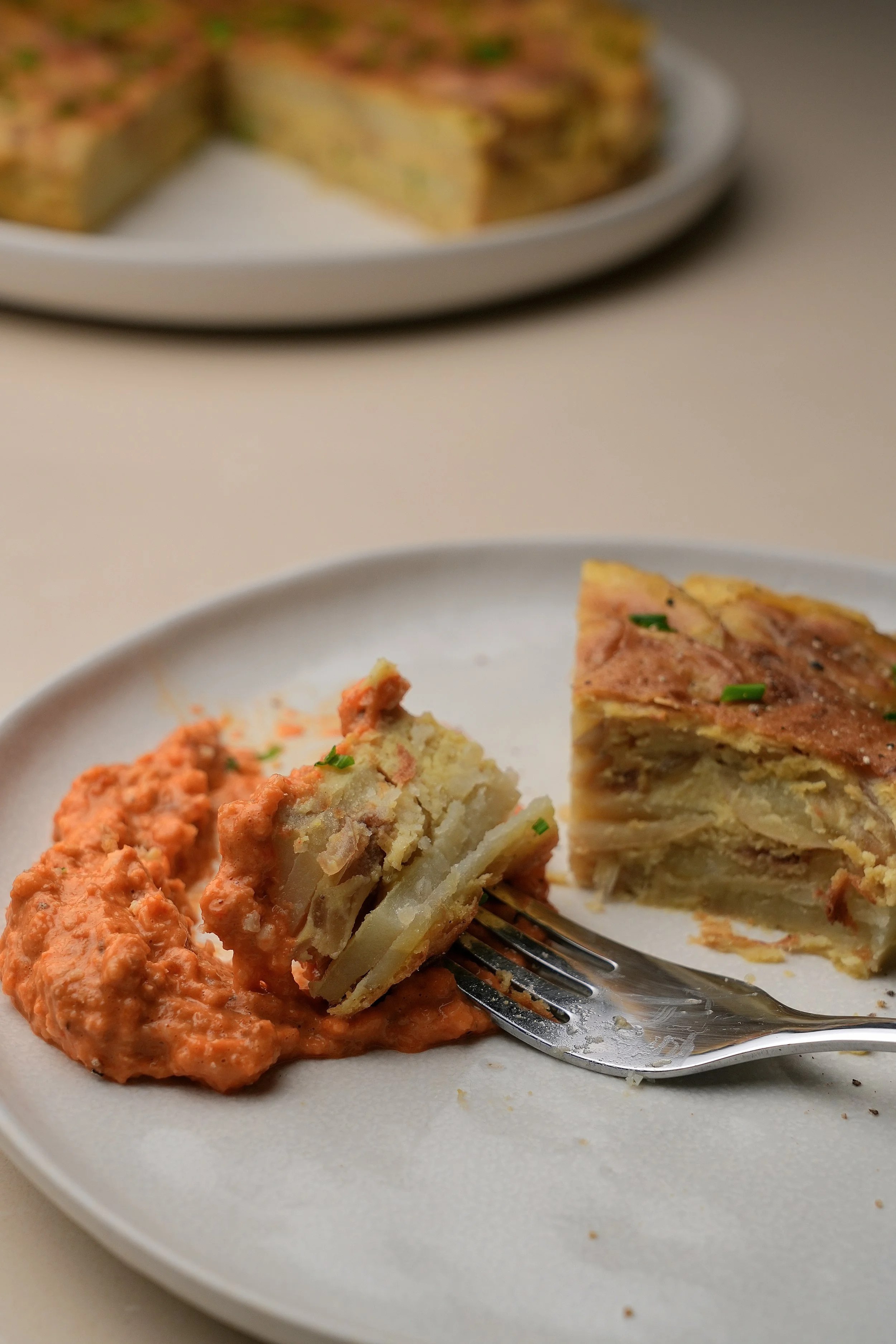image of vegan spanish tortilla omelette with romesco dip
