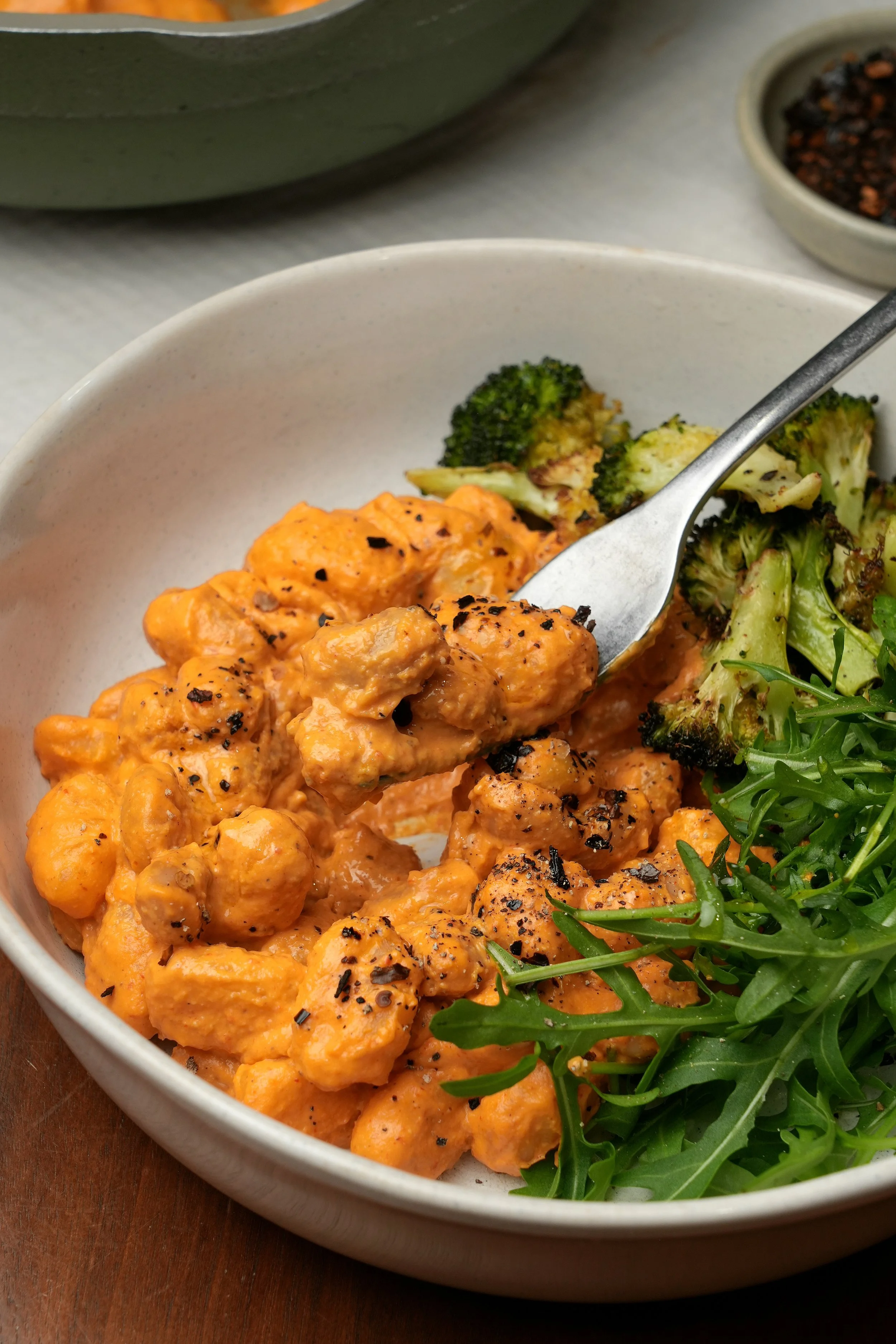 image of vegan high protein high fibre roasted pepper gnocchi with charred broccoli