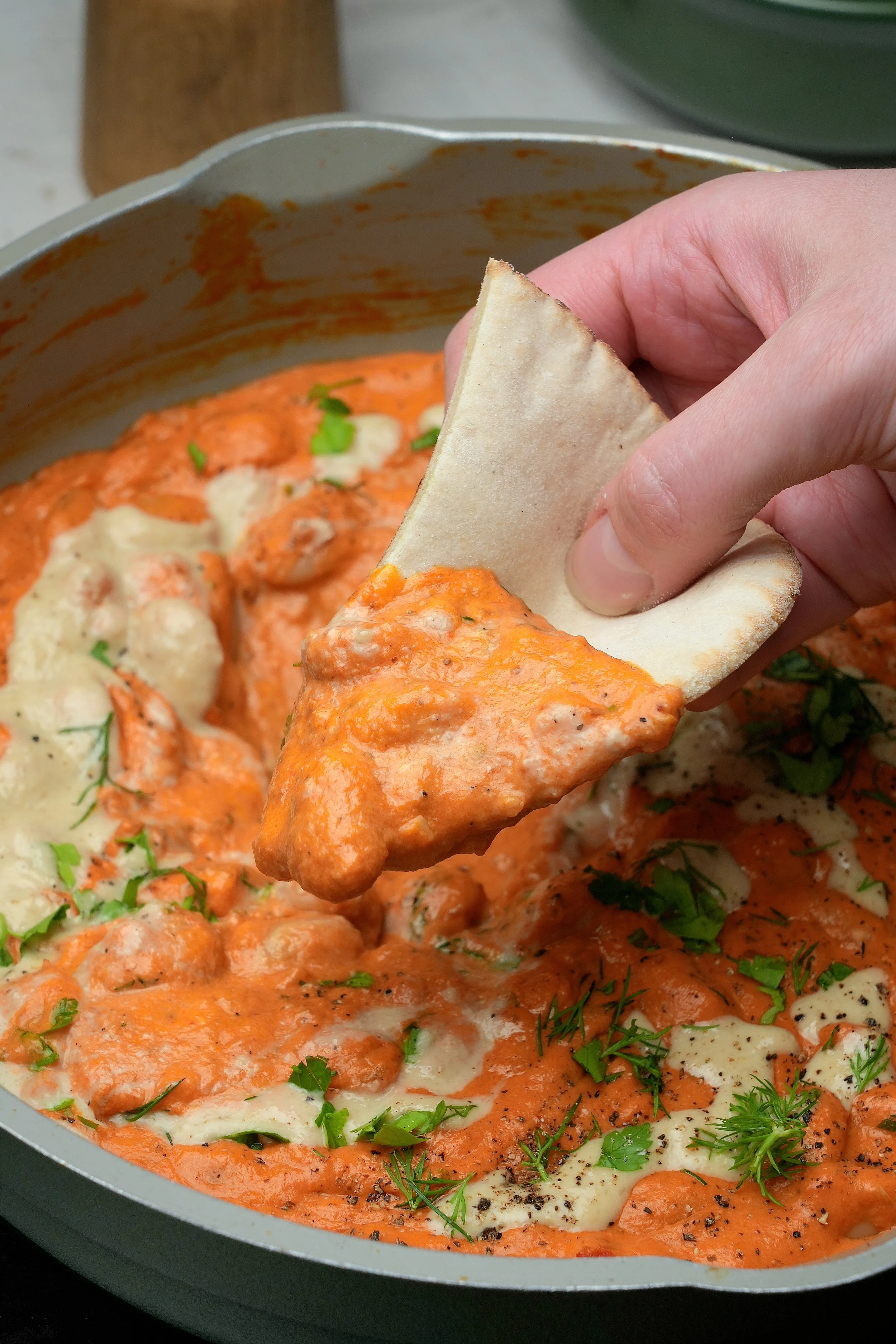 image of creamy vegan high protein harissa and roasted red pepper butter beans meal prep batch cook