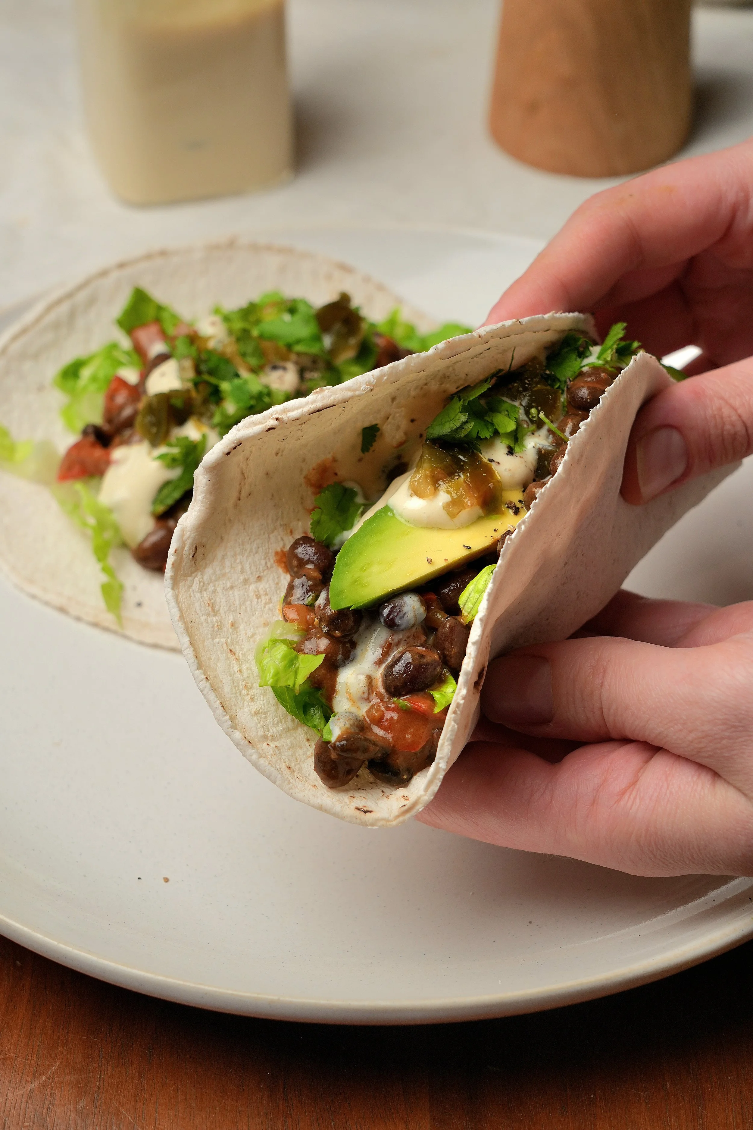image of creamy high protein peanut butter black beans with silken tofu cream vegan plant based high fibre meal prep batch cook friendly in tacos