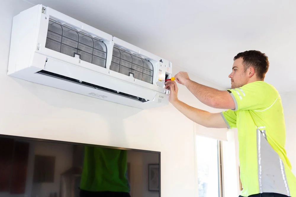 modserve technician servicing a mitsubishi electric heat pump