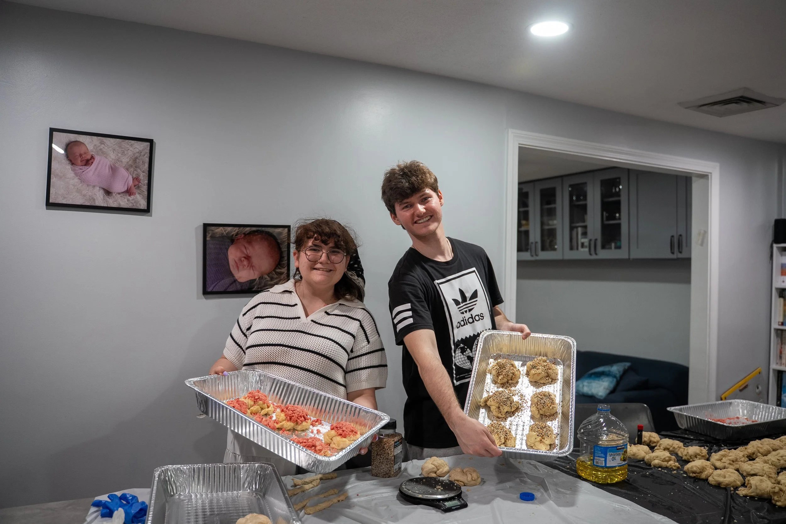 Students holding trays of challah