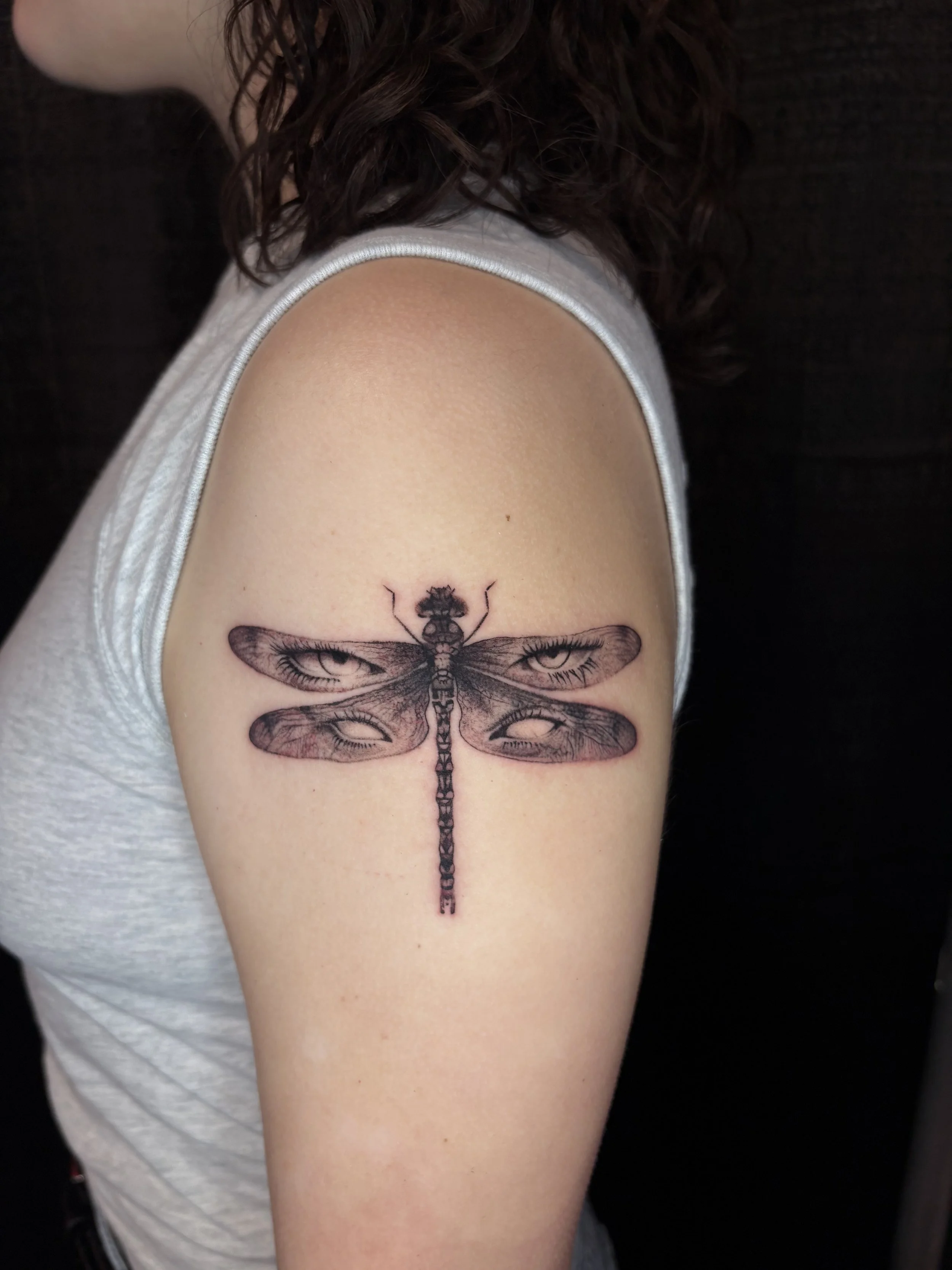 Tattoo of a dragonfly with eyes in the wings. Surrealism Tattoo Done by Pablo at Ink Terminal Ottawa Gatineau
