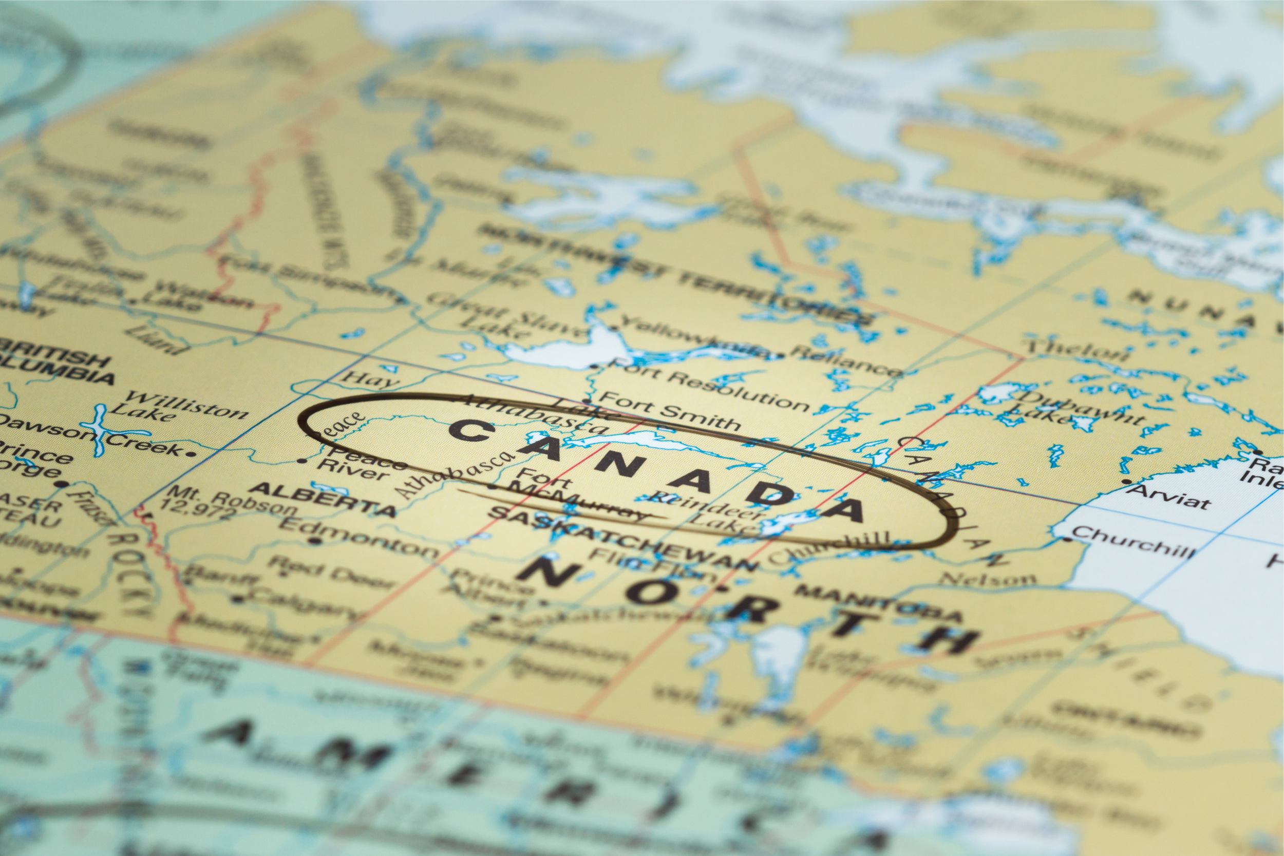Close up of a map of Canada with the word Canada circled in black marker.