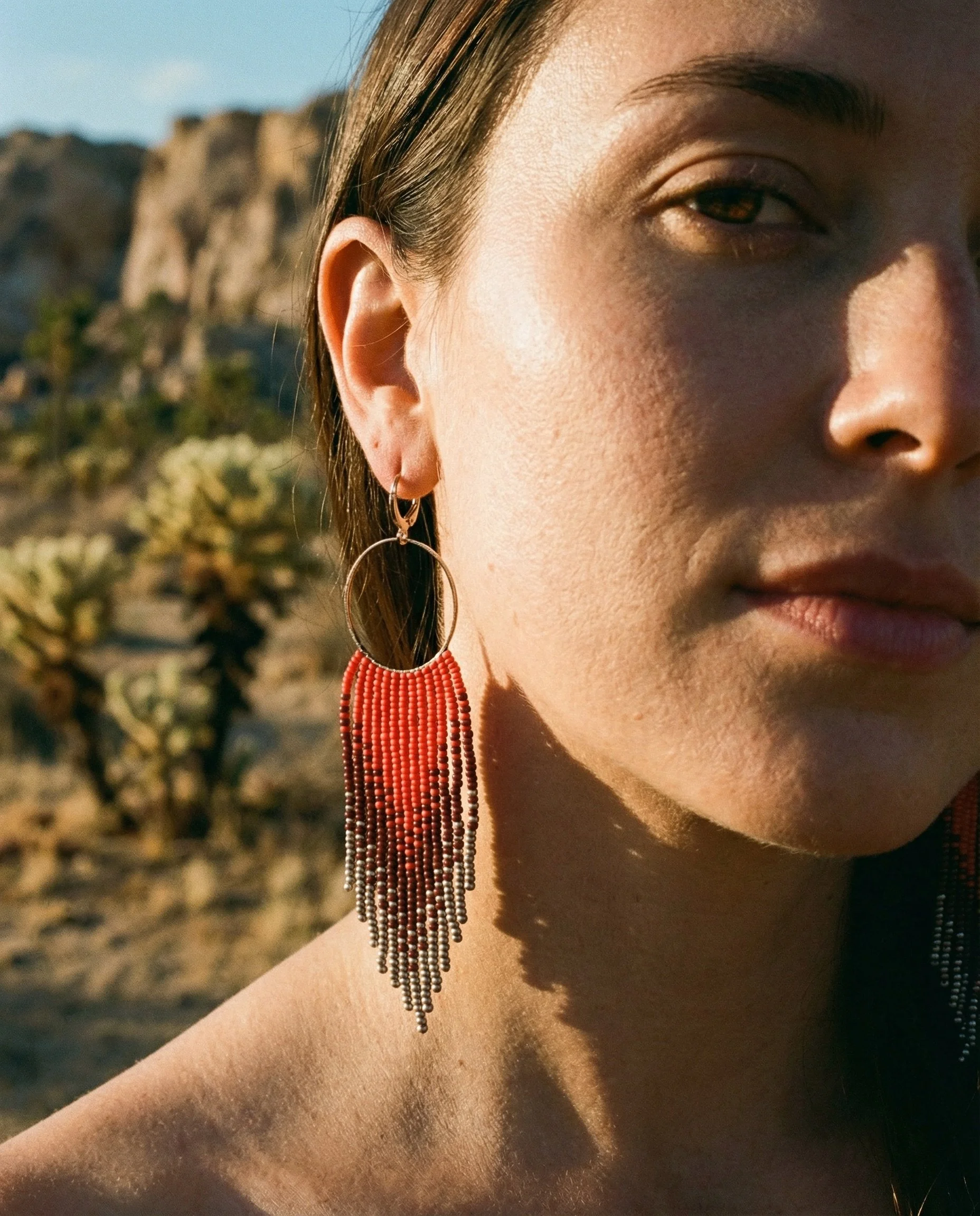 phoenix rising earring female model.jpg