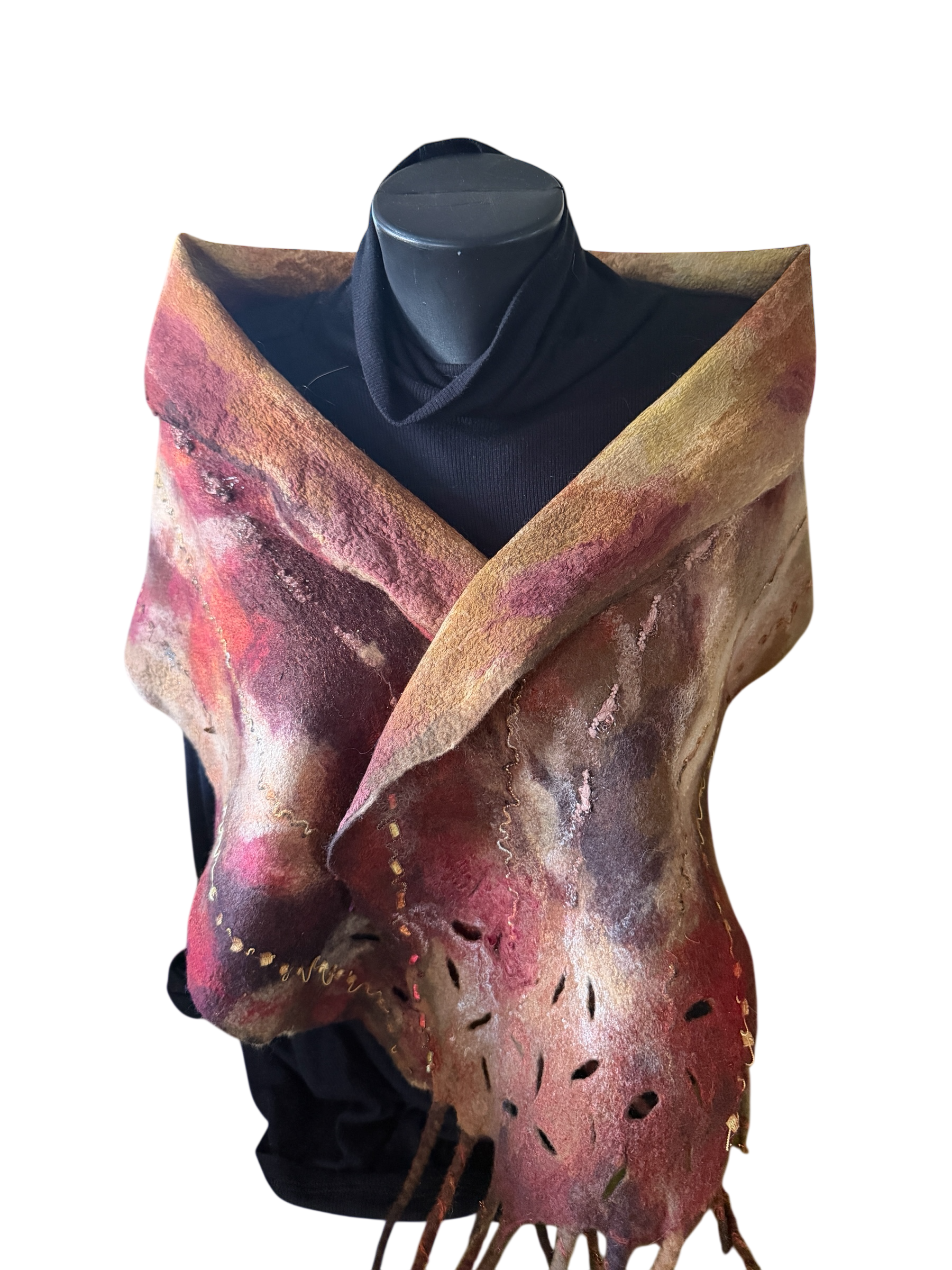 Hand-felted merino wool and Silk wrap in burgundy, blush, cream, and brown, featuring an organic wrap design with textured edges and cutout details. 

 70"L x 13"W including fringe,  $175