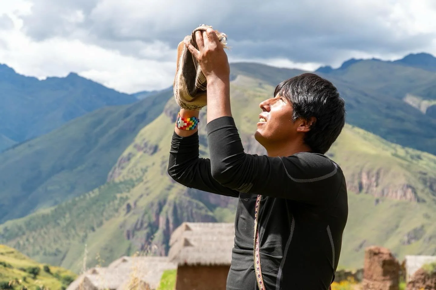 Our Quechua guide, Rolando, lifts coca leaves to the Apus, invoking ancient blessings and connecting with the spirits of the mountains. 🌬️ 🍃 ⛰️