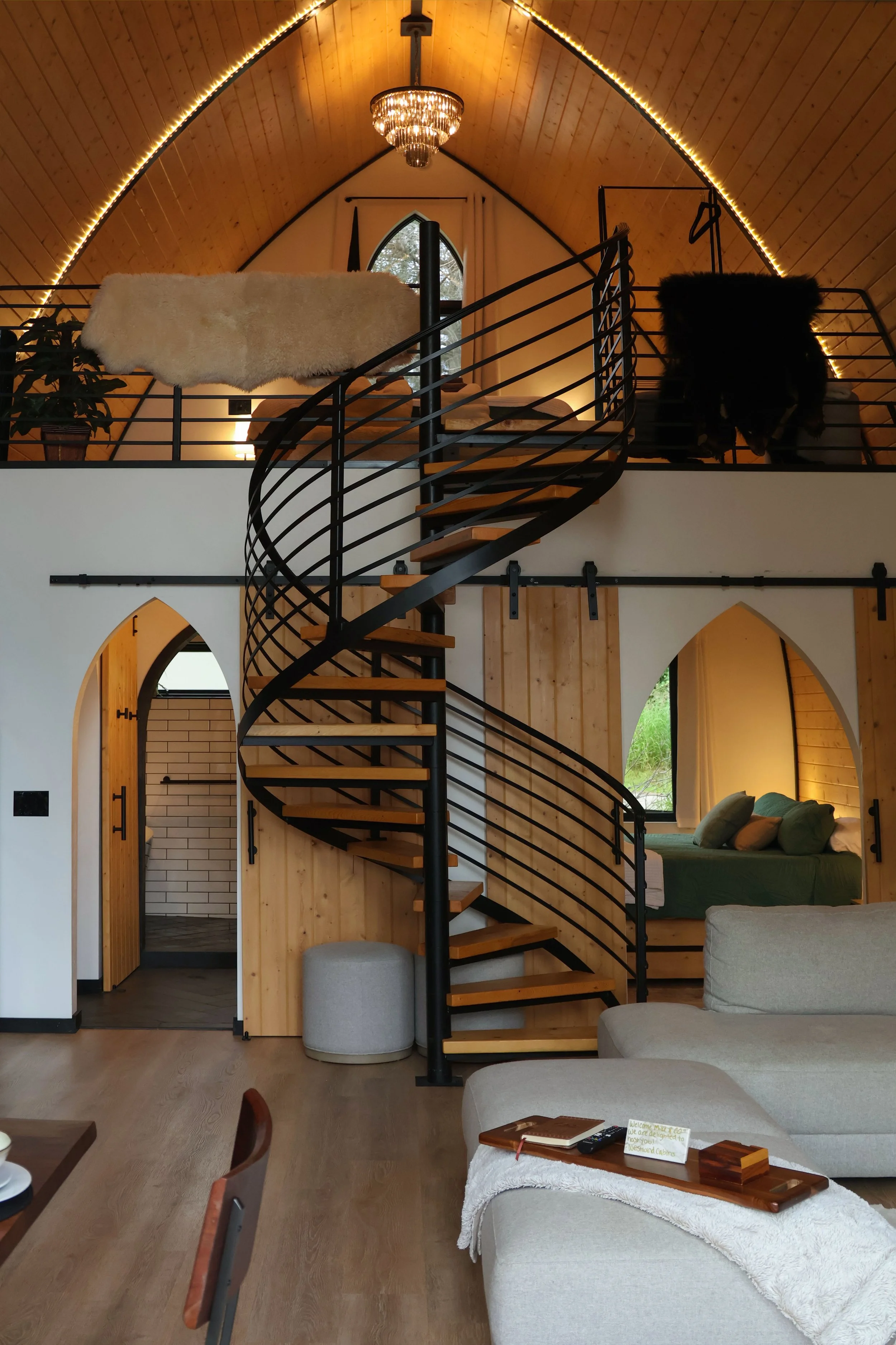 Gorgeous spiral staircase leading to the top bedroom 