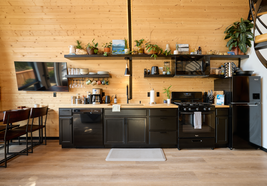 Fully stocked kitchen and includes a full size fridge and dishwasher