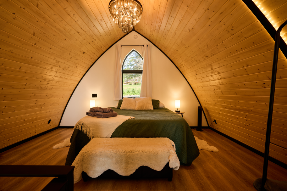 Spacious top floor bedroom with a king bed