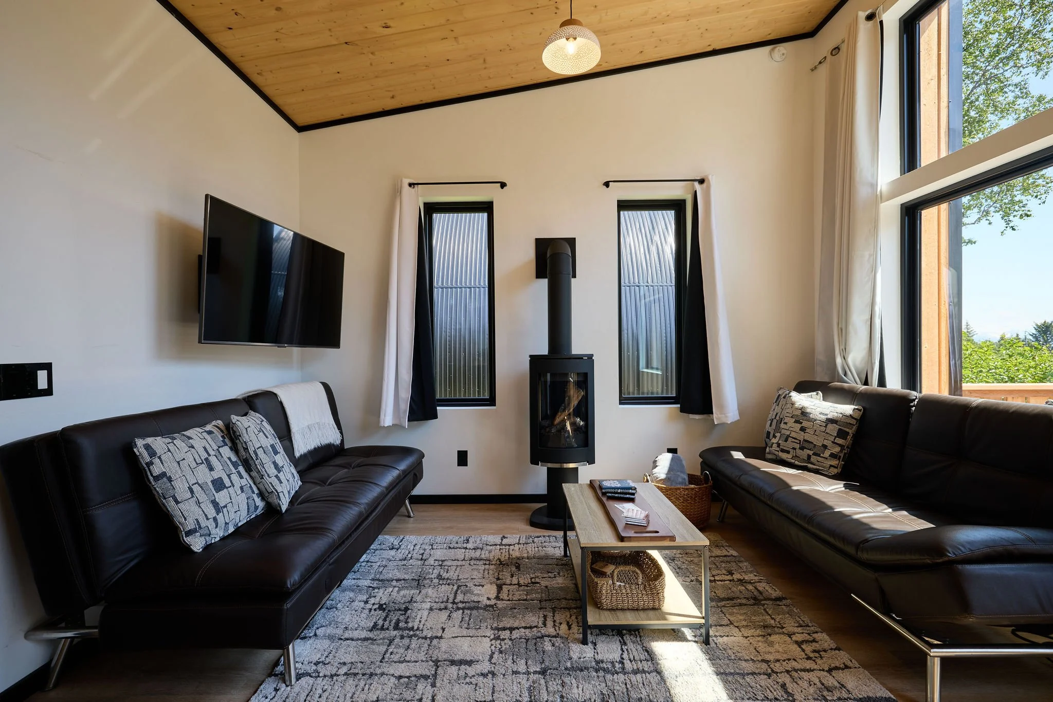 Spacious living room with two futon couches 