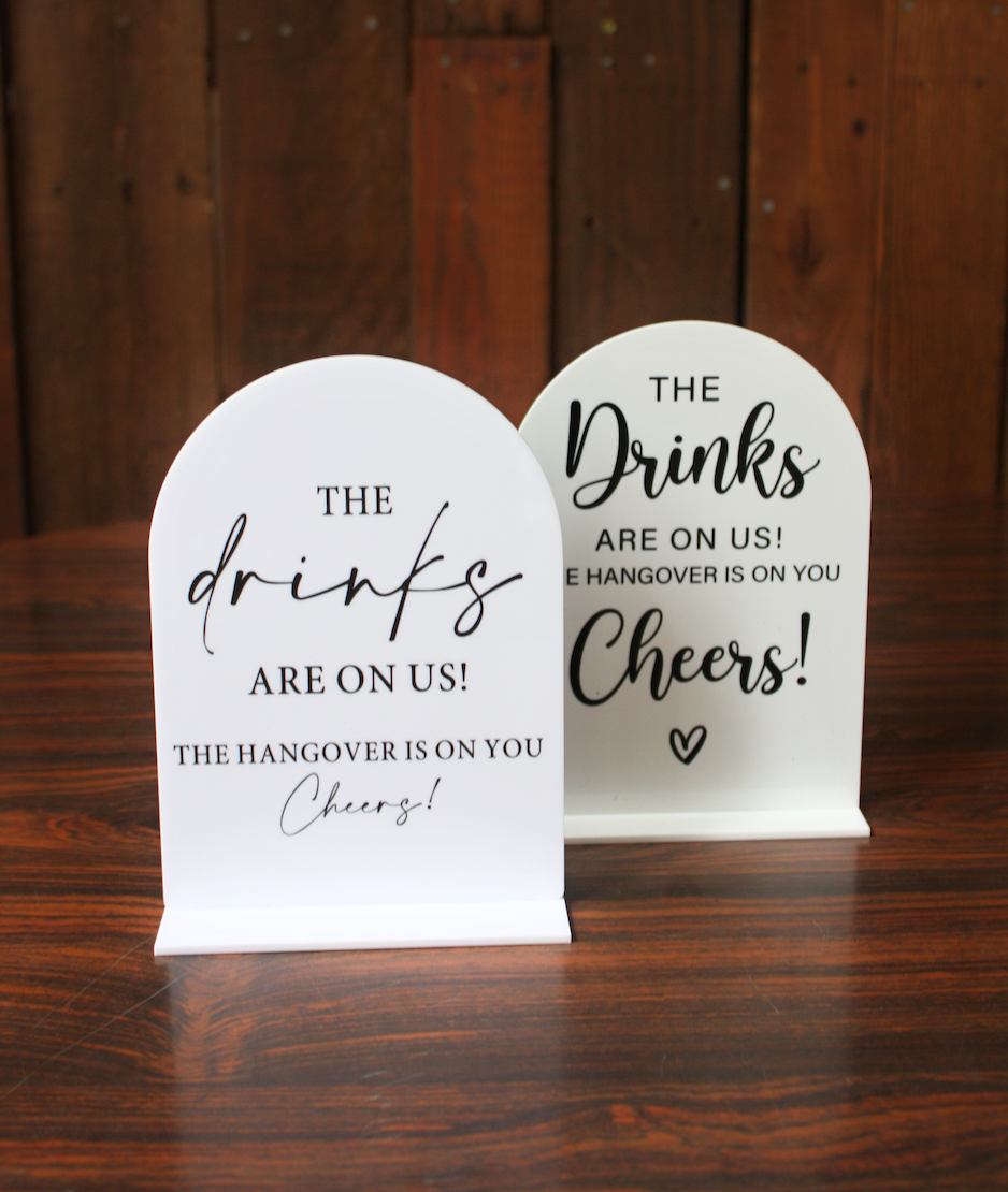 Drinks on Us Signs