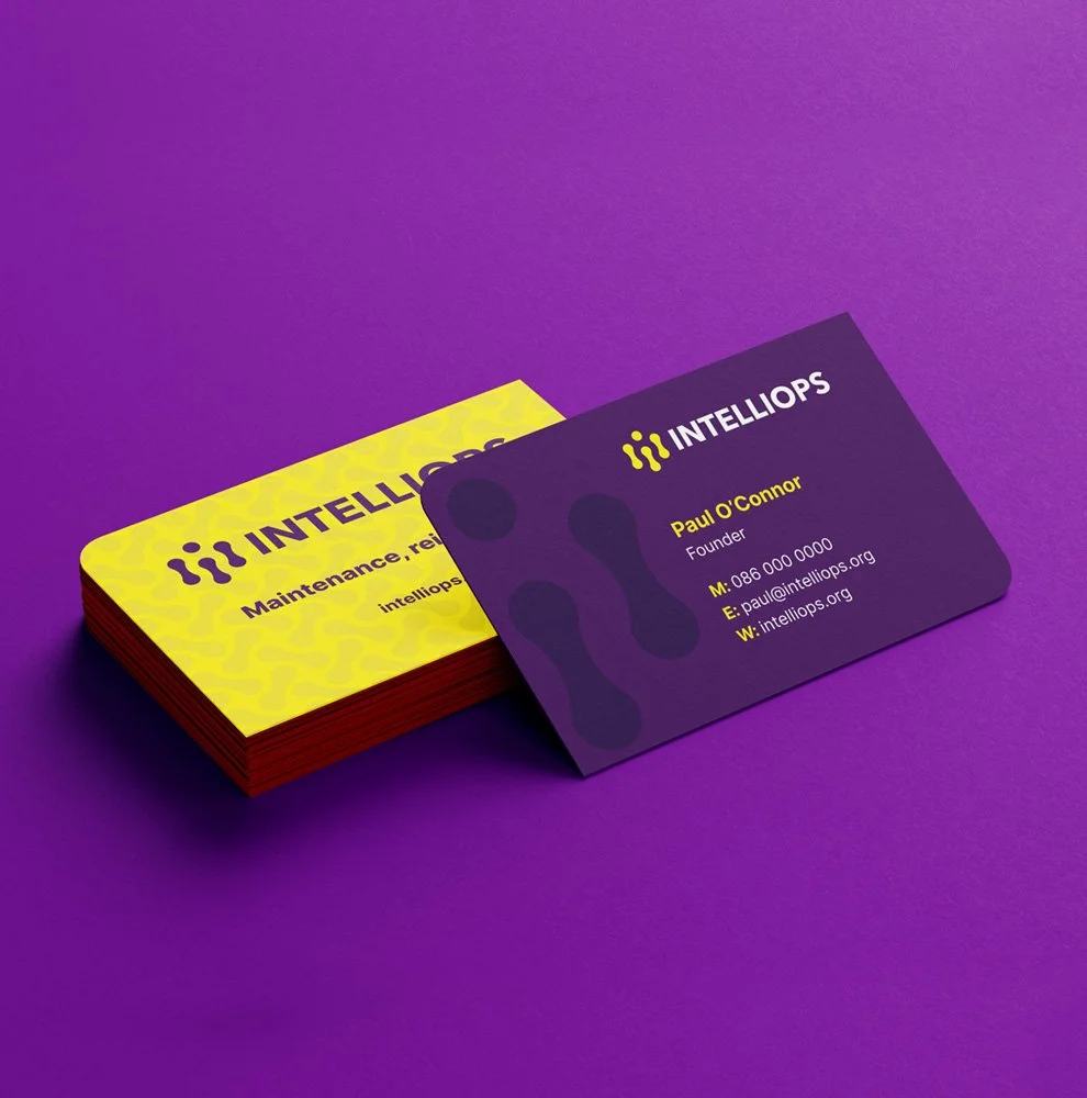 IntelliOps business card design with purple and yellow SaaS brand identity