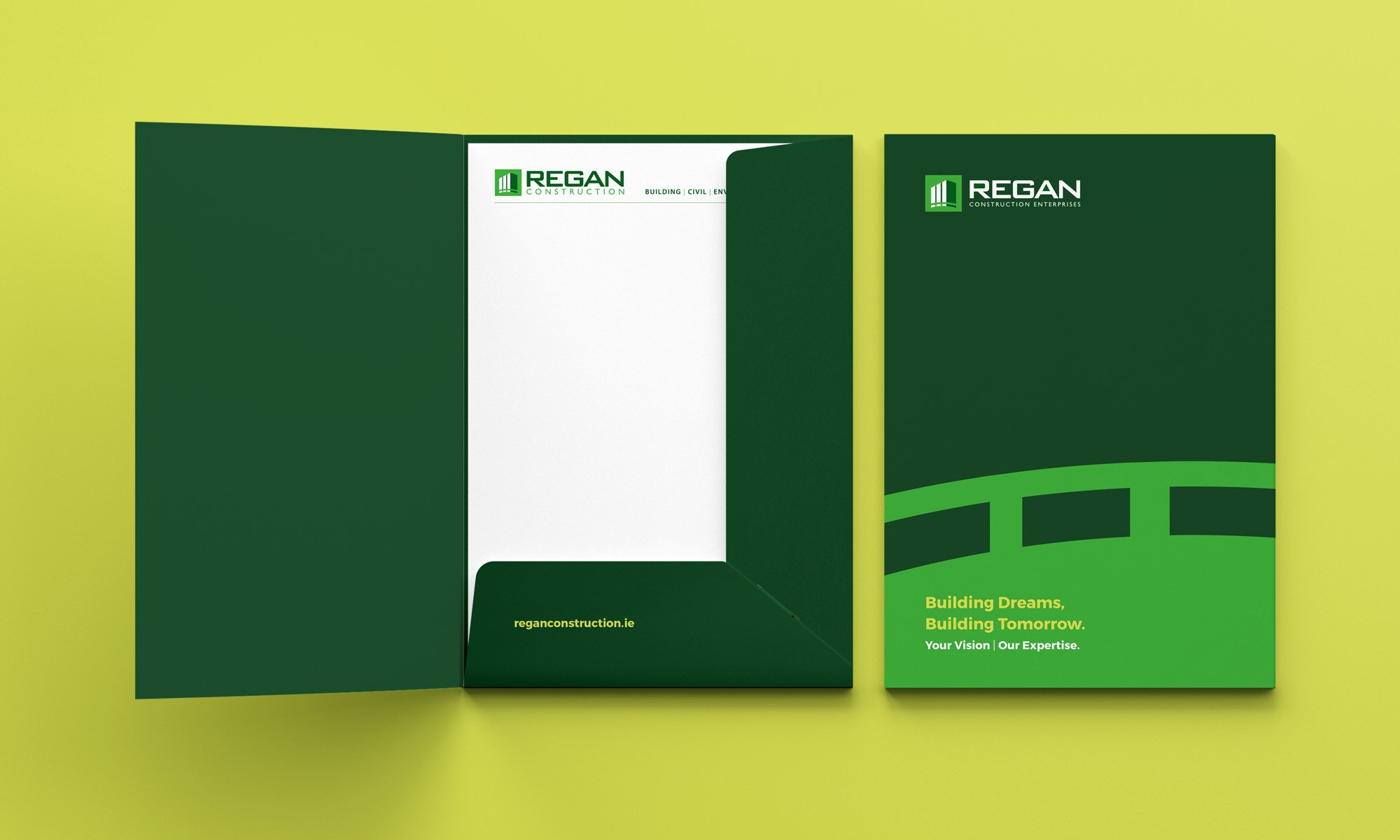 Regan Construction presentation pocket folder featuring logo and brand elements.