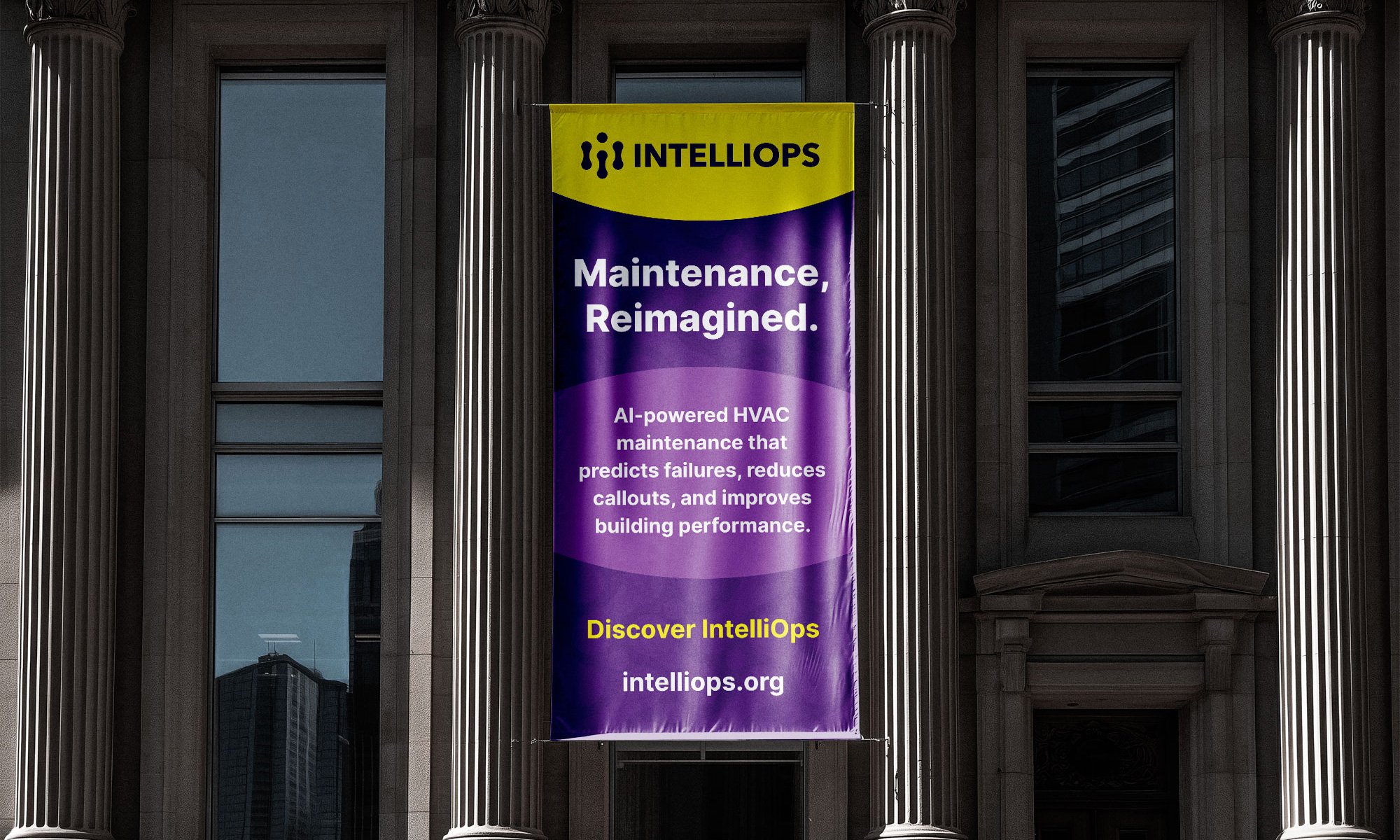 IntelliOps outdoor banner advertising AI HVAC platform with “Maintenance, Reimagined” message