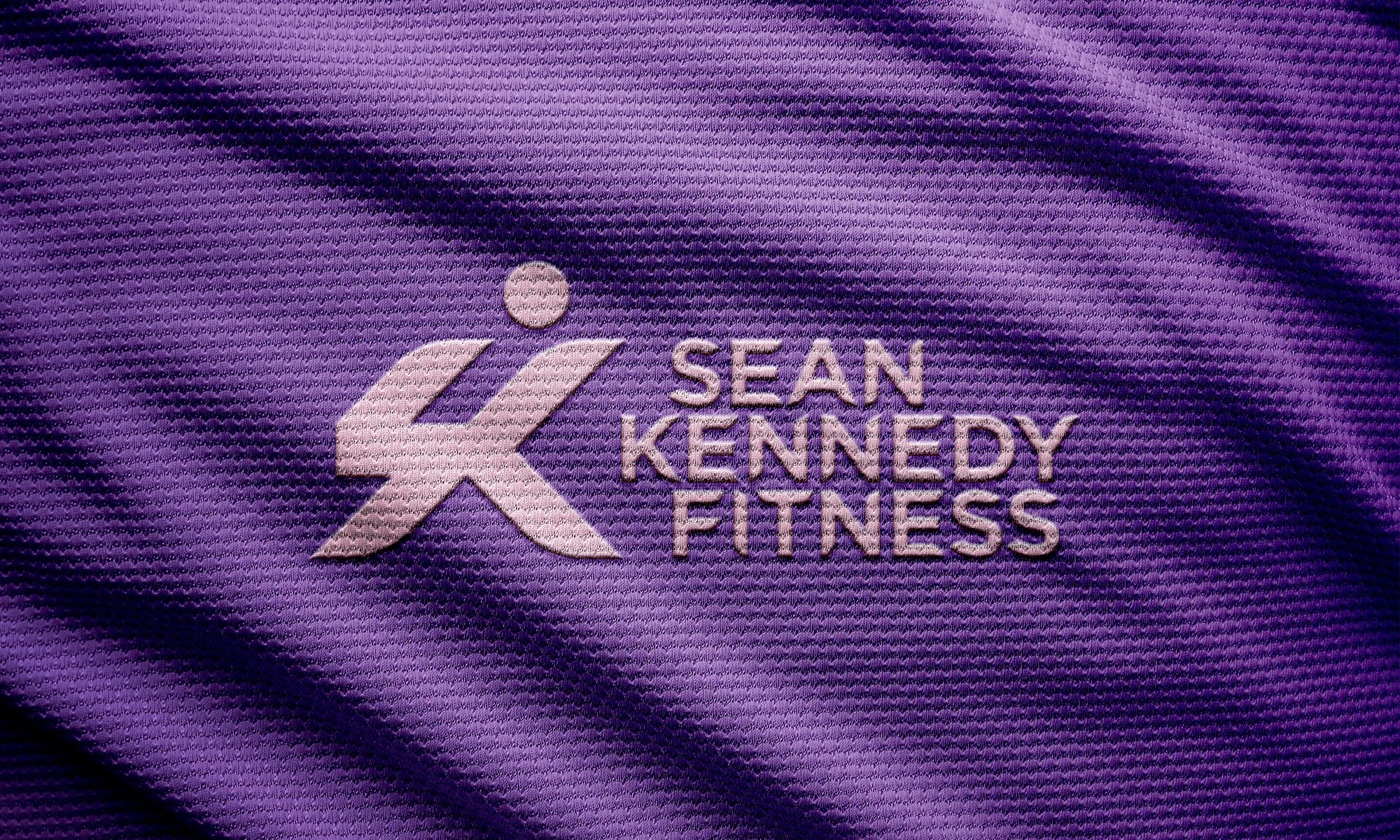 Sean Kennedy Fitness logo on sports top