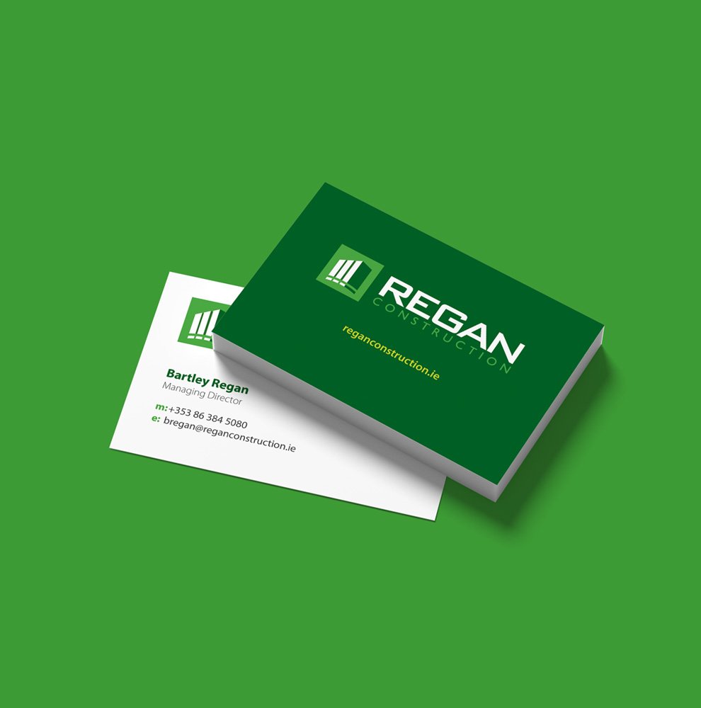 Regan Construction business card showing logo design and brand colours