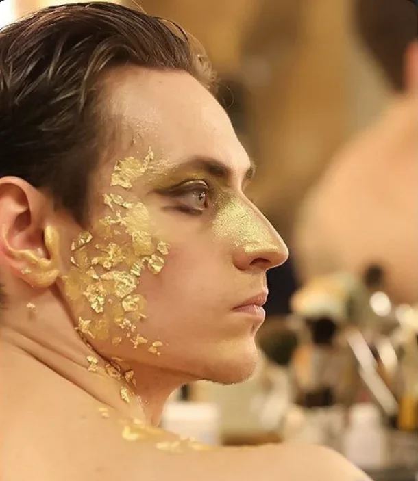 gold face profile.webp
