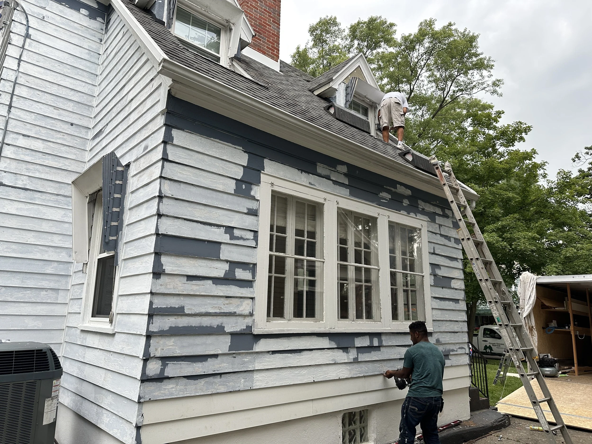priming red wood siding.JPG